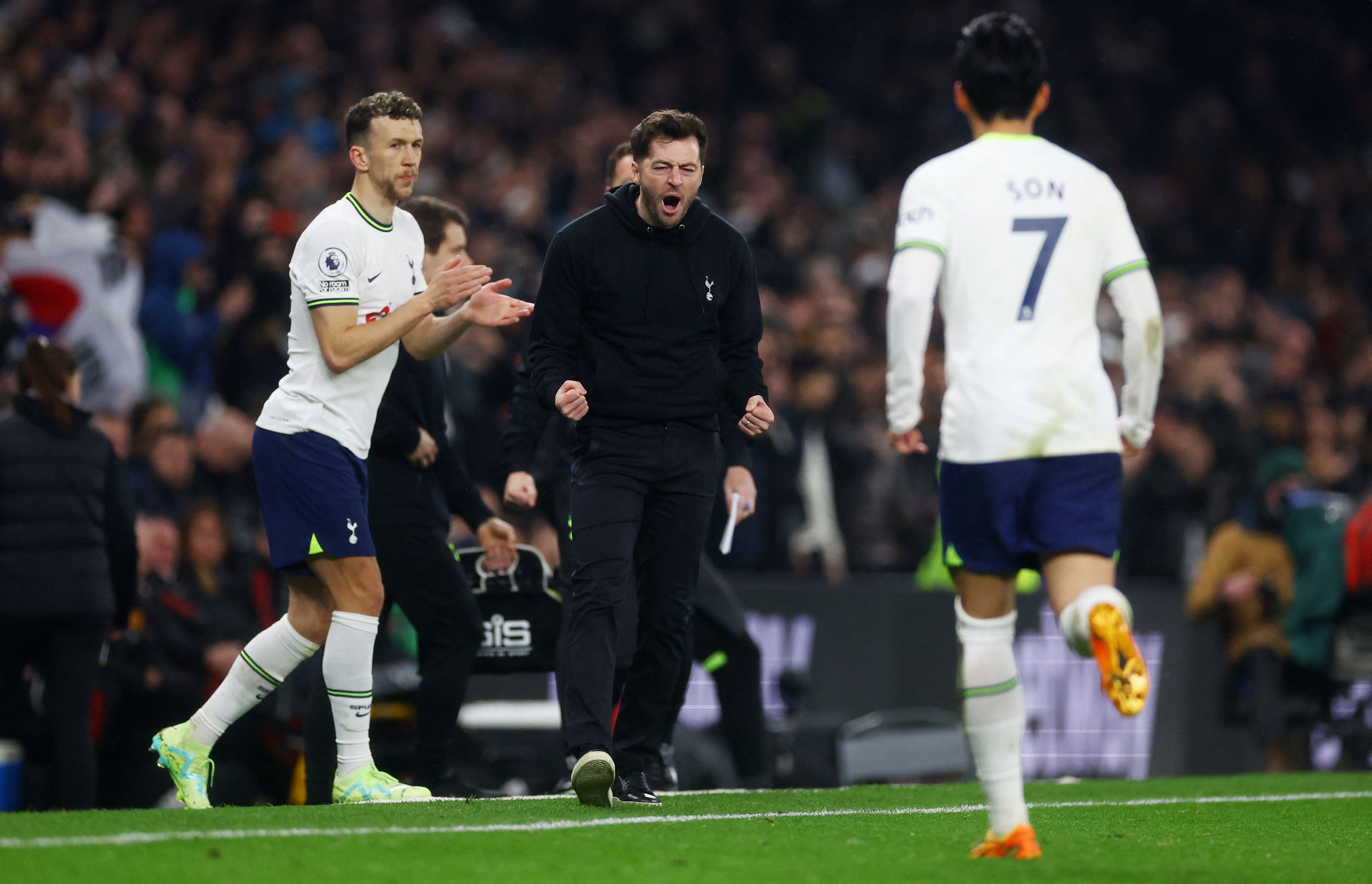 Tottenham Hotspur's Son Heung-min celebrates scoring their second goal with interim manager Ryan Mason