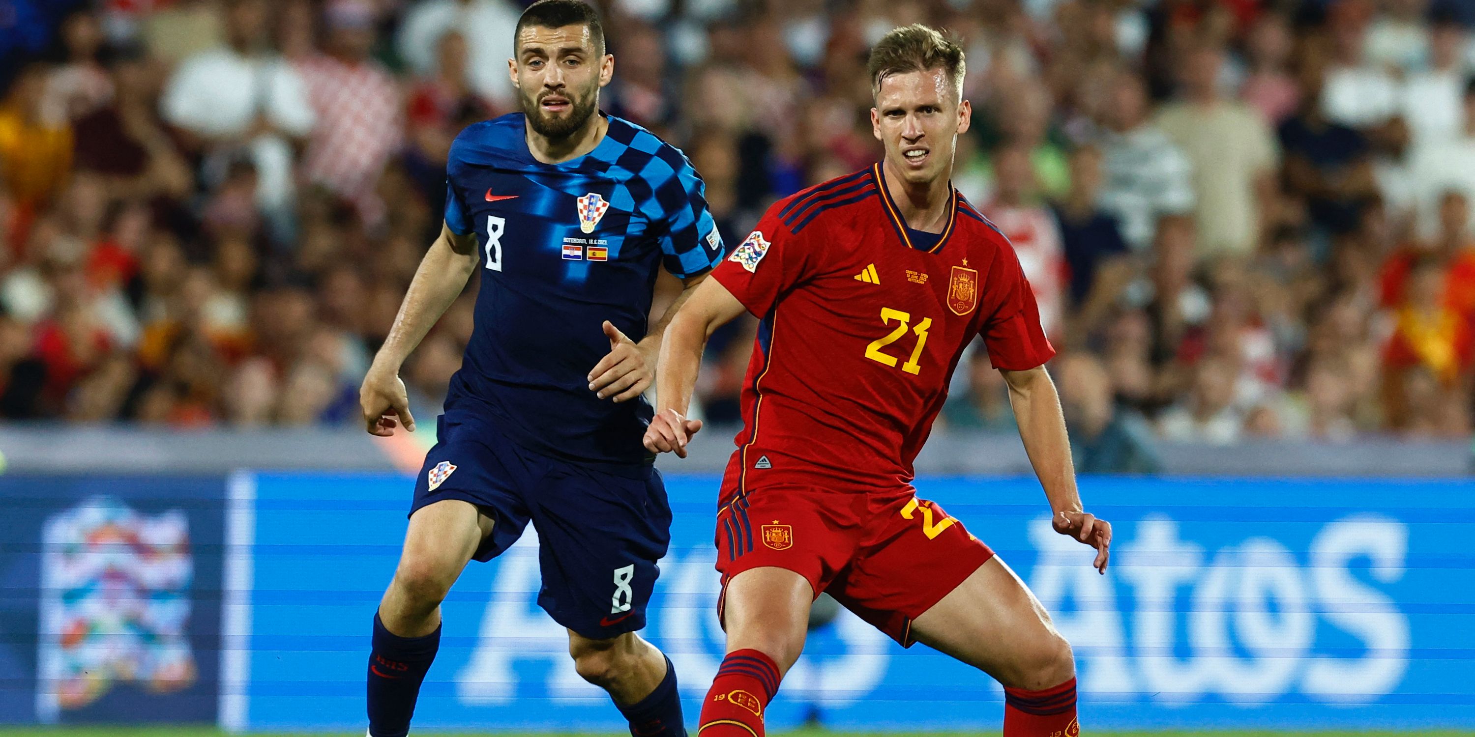 Spain's Dani Olmo in action with Croatia's Mateo Kovacic