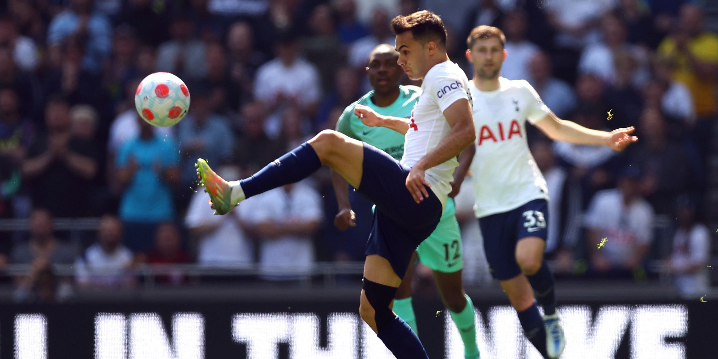 Sergio Reguilon of Tottenham Hotspur plays with Enock Mwepu of Brighton & Hove Albion