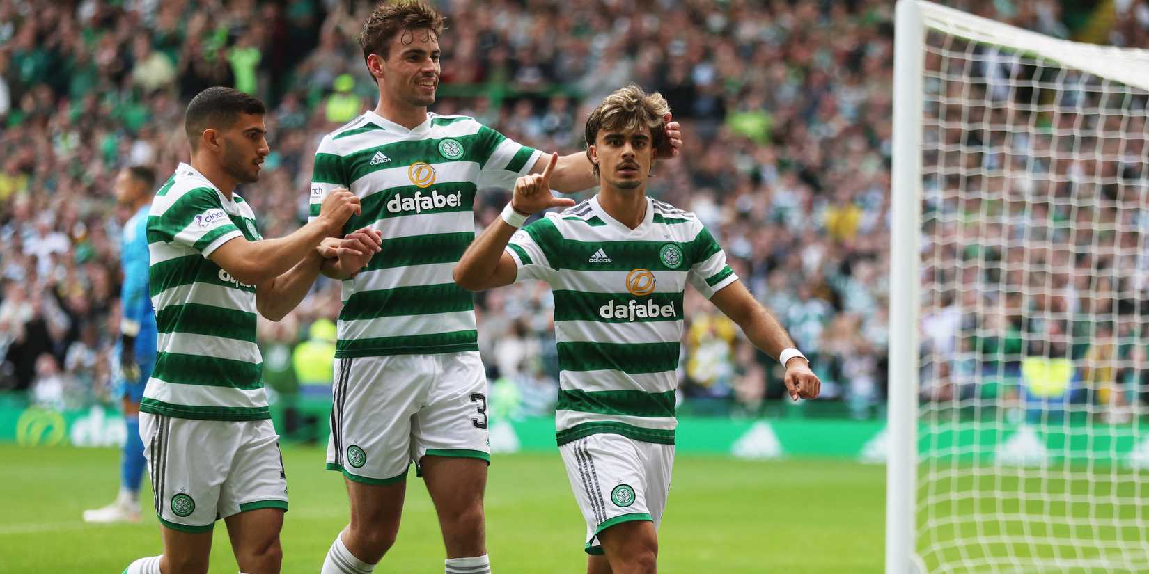Celtic's Jota celebrates scoring their second goal with teammates