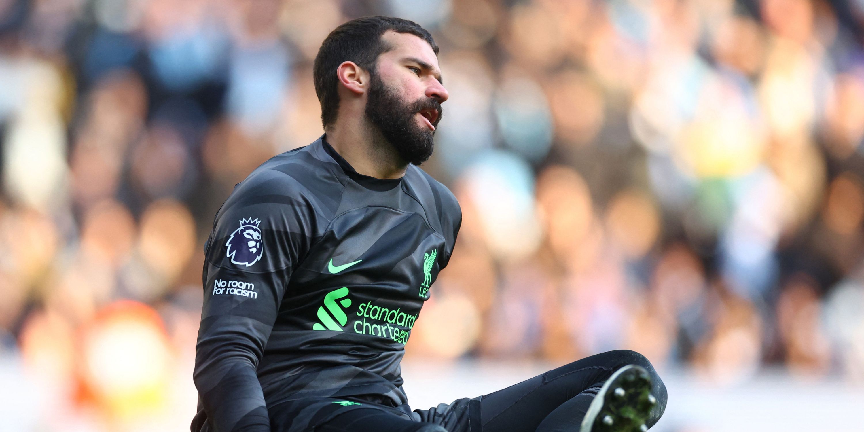Liverpool goalkeeper Alisson in action against Manchester City