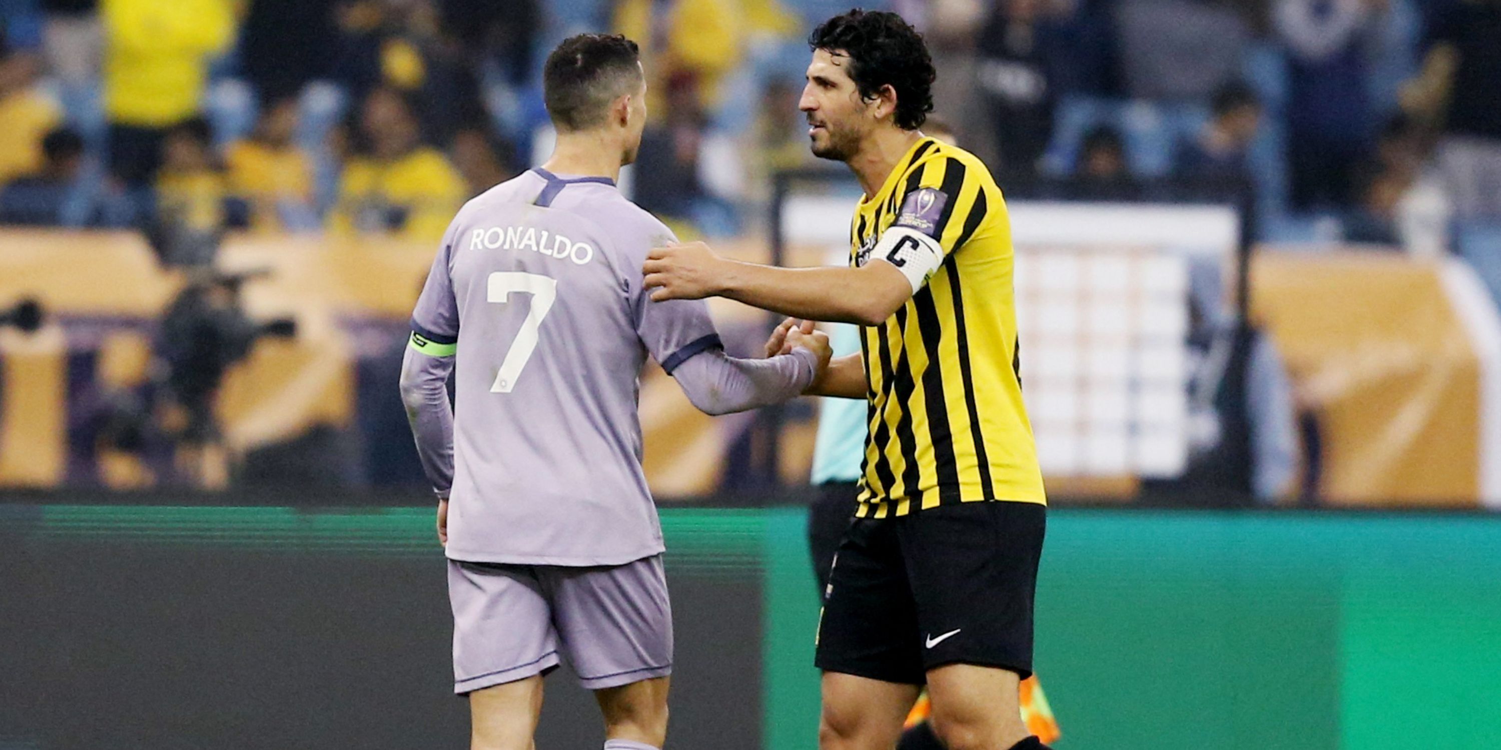 Al-Ittihad's Ahmed Hegazy shaking hands with Cristiano Ronaldo