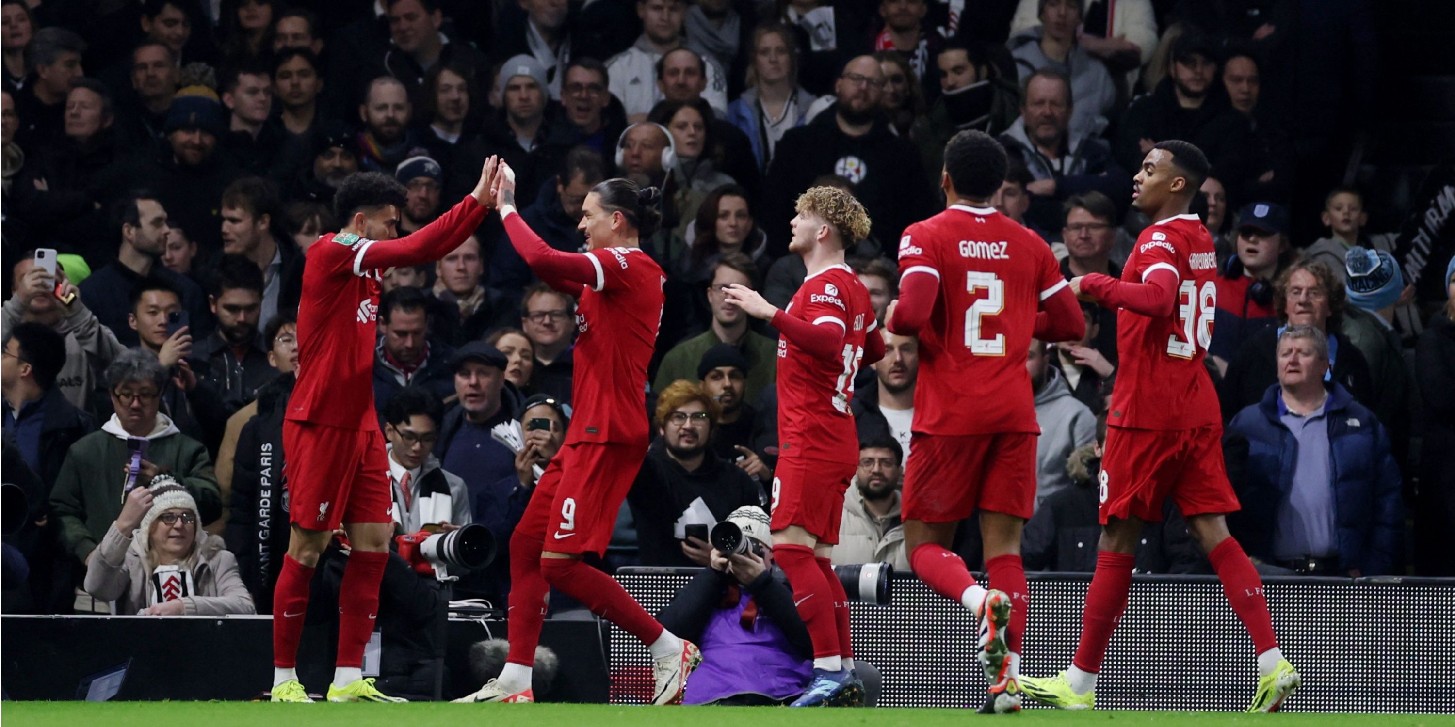 Harvey Elliott celebrates with Liverpool teammates. 