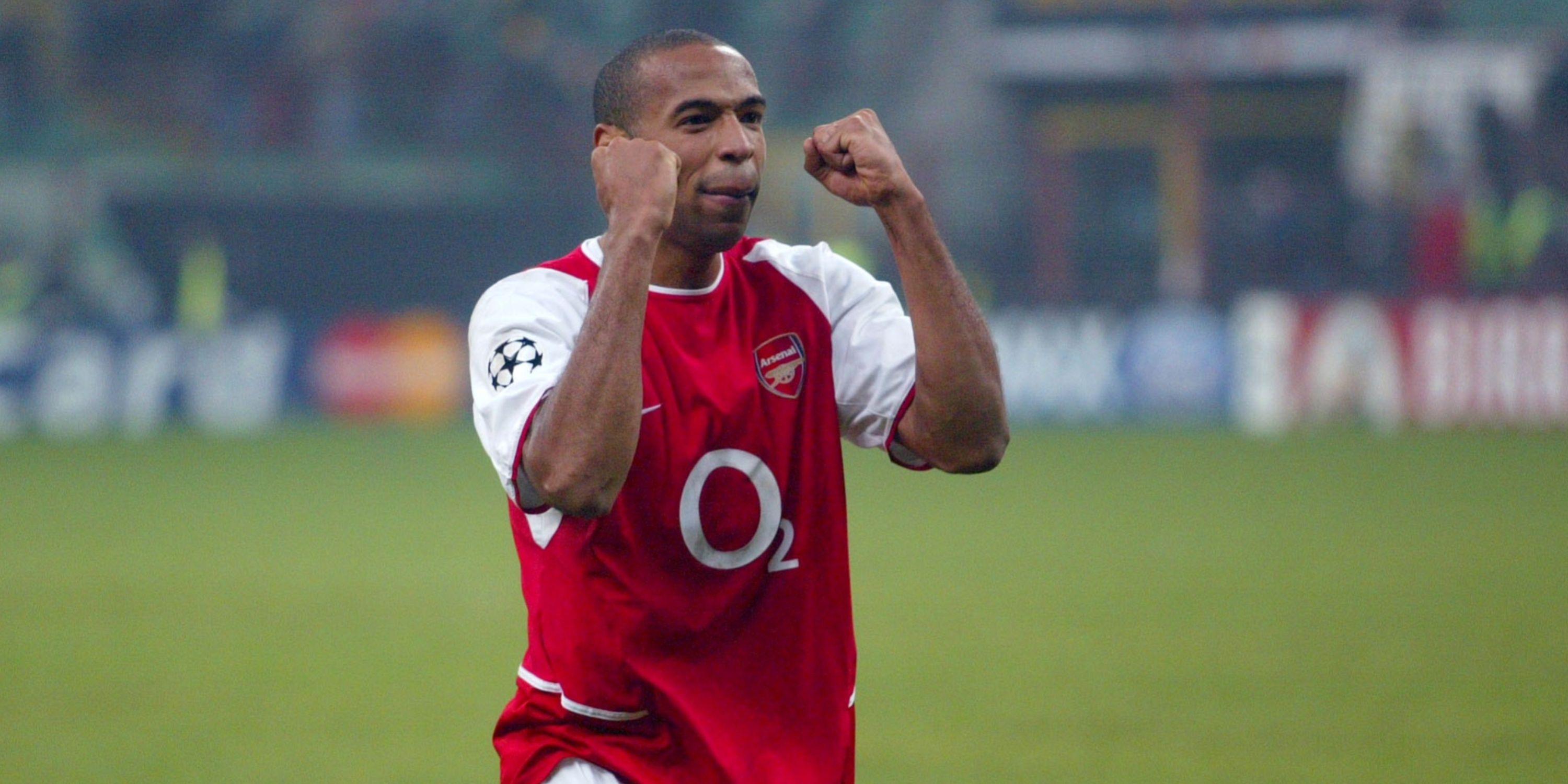 Thierry Henry celebrating for Arsenal.