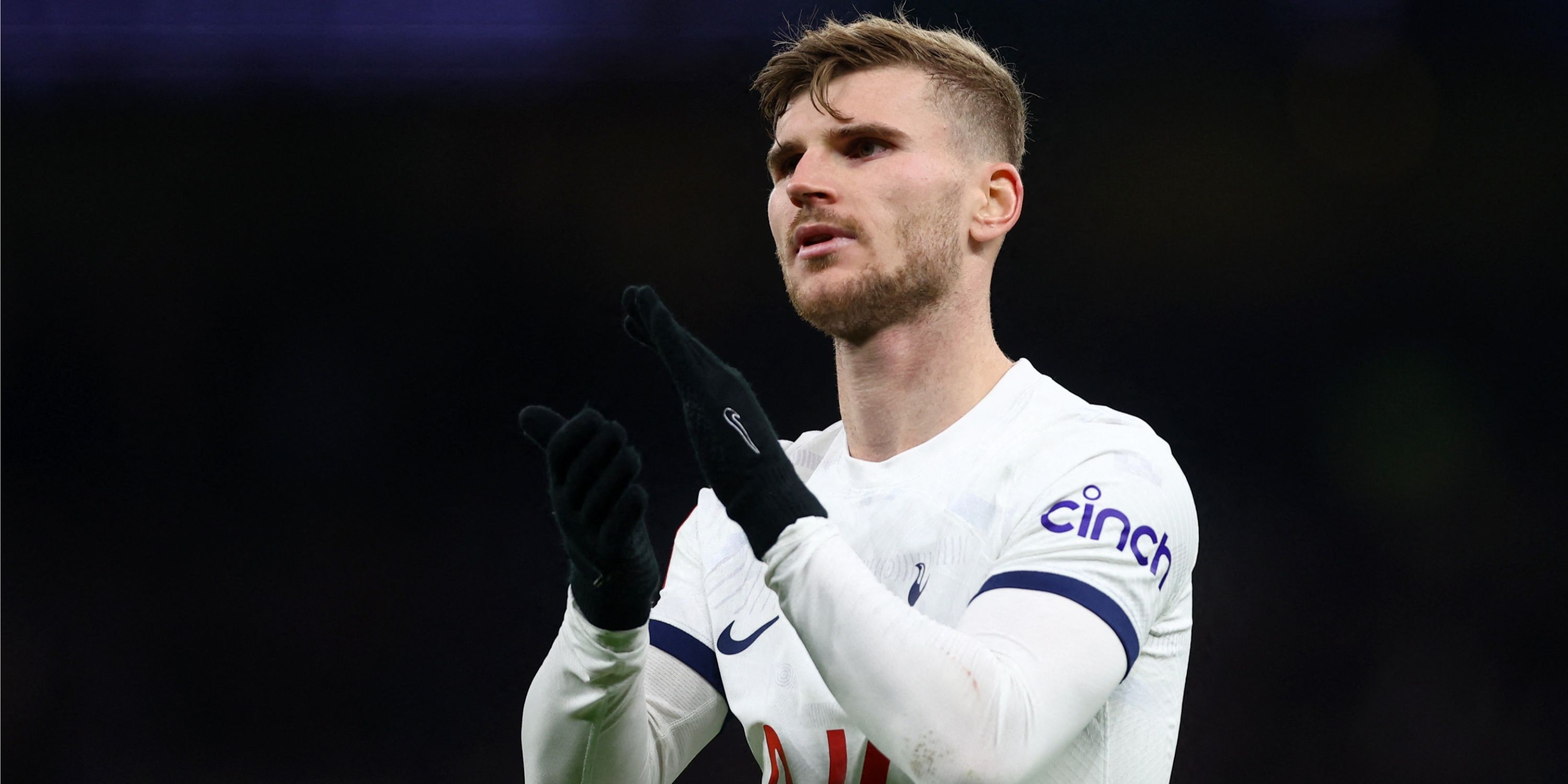 Timo Werner applauding Tottenham supporters. 