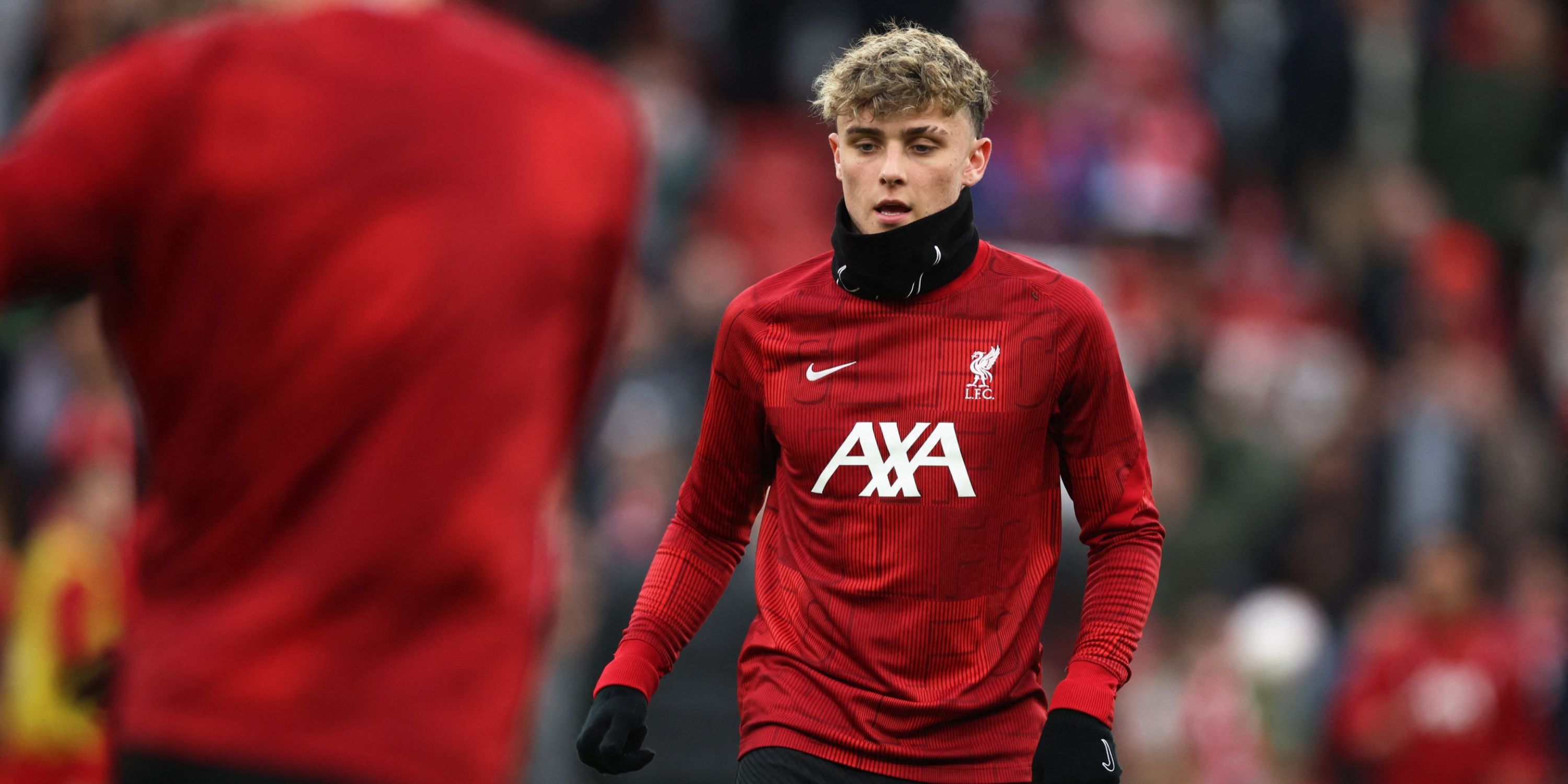 Liverpool player Bobby Clark warming up.