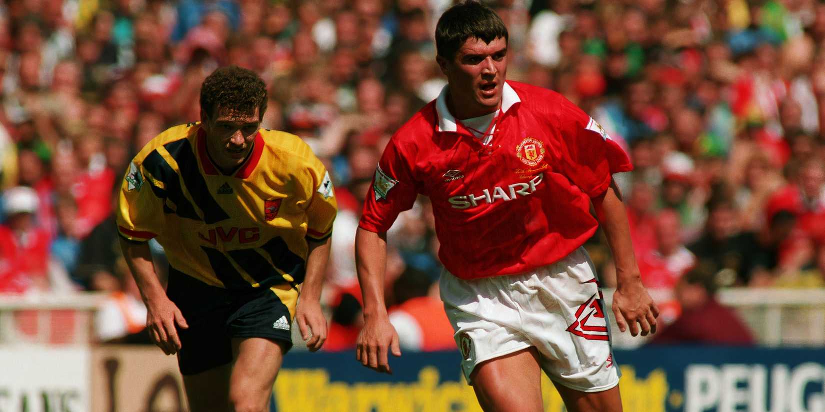 jensen-roy-keane-man-utd-community-escudo