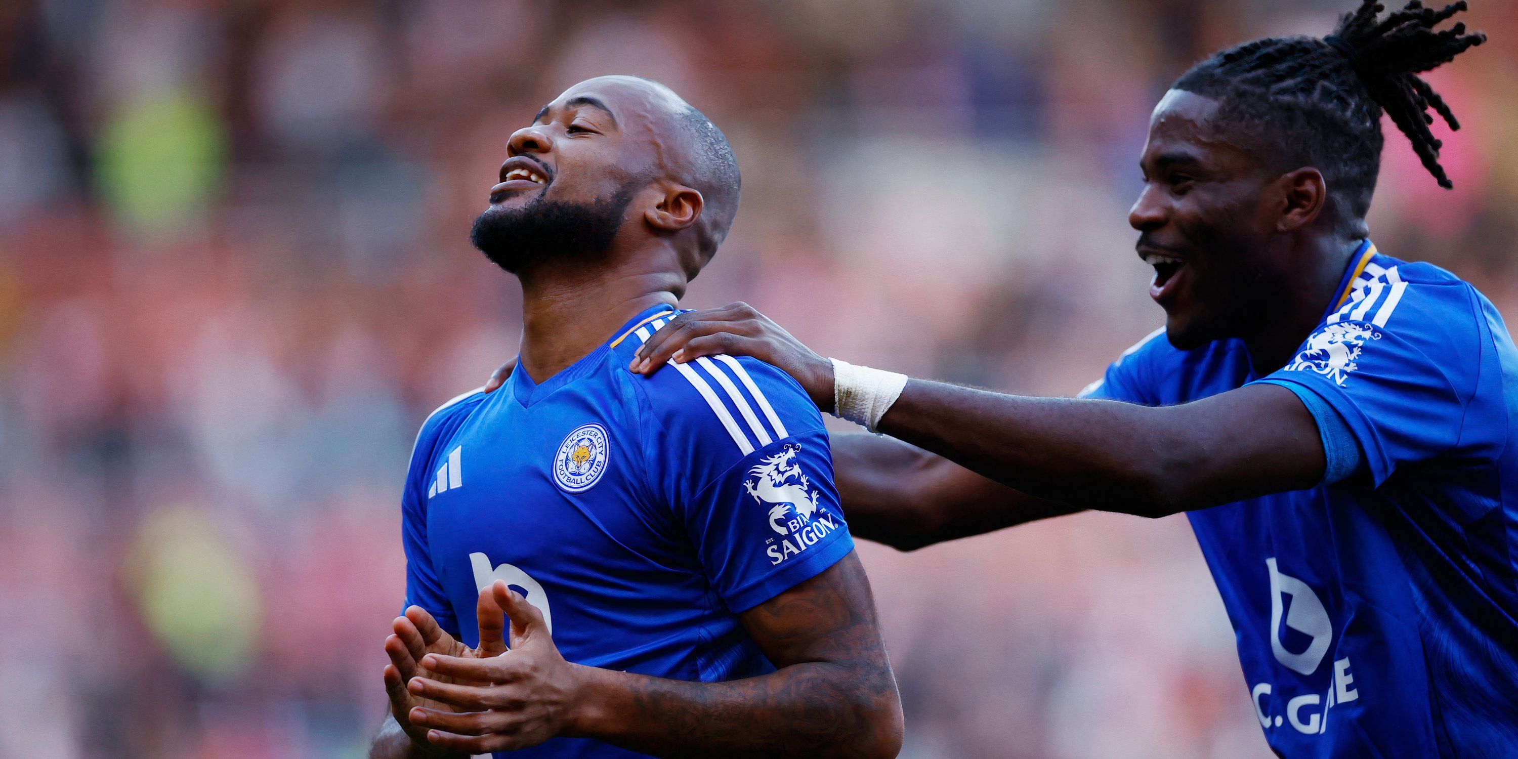 Leicester City's Jordan Ayew and Caleb Okoli celebrate after the match