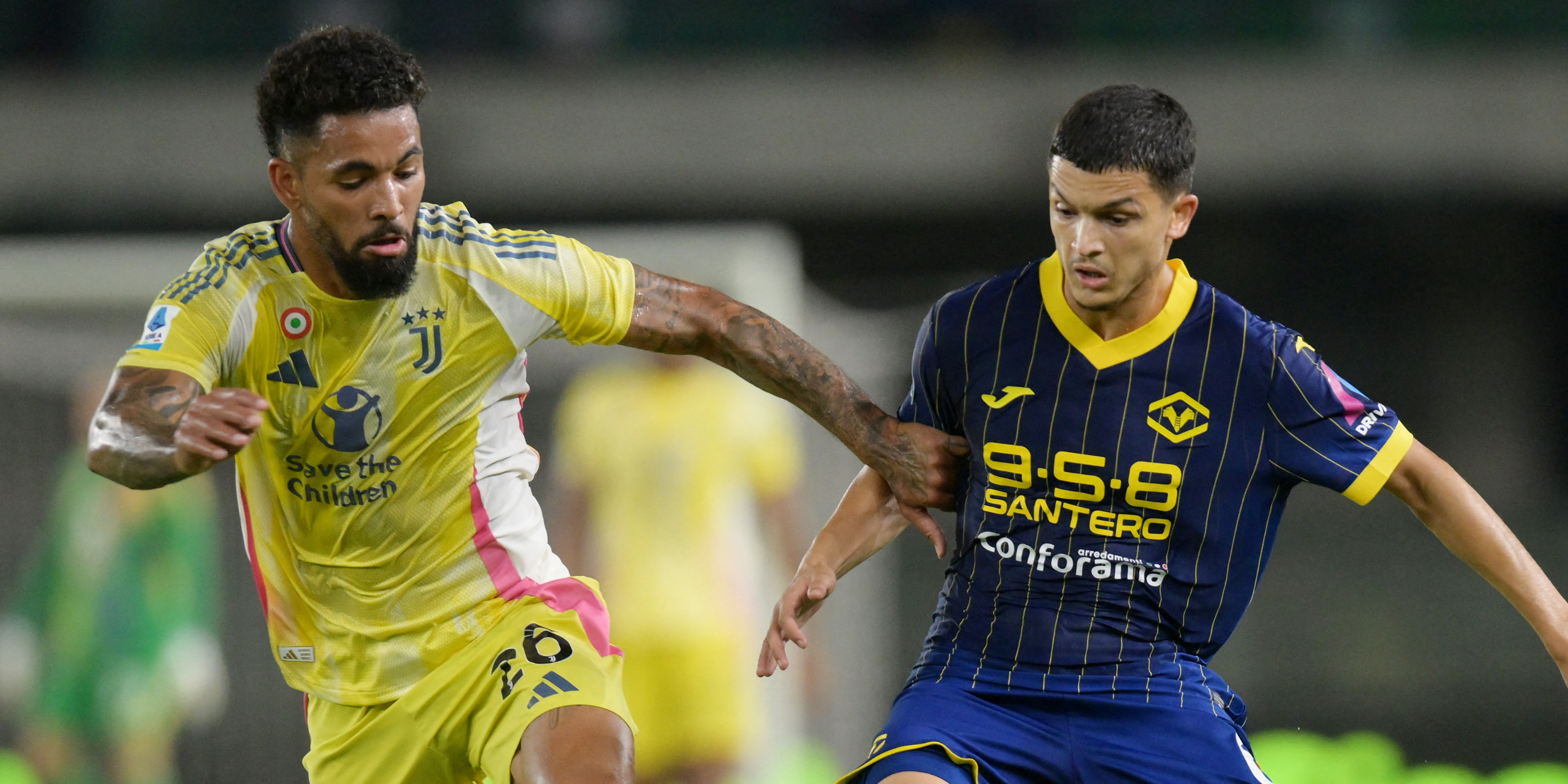 Juventus' Douglas Luiz in action with Hellas Verona's Reda Belahyane.