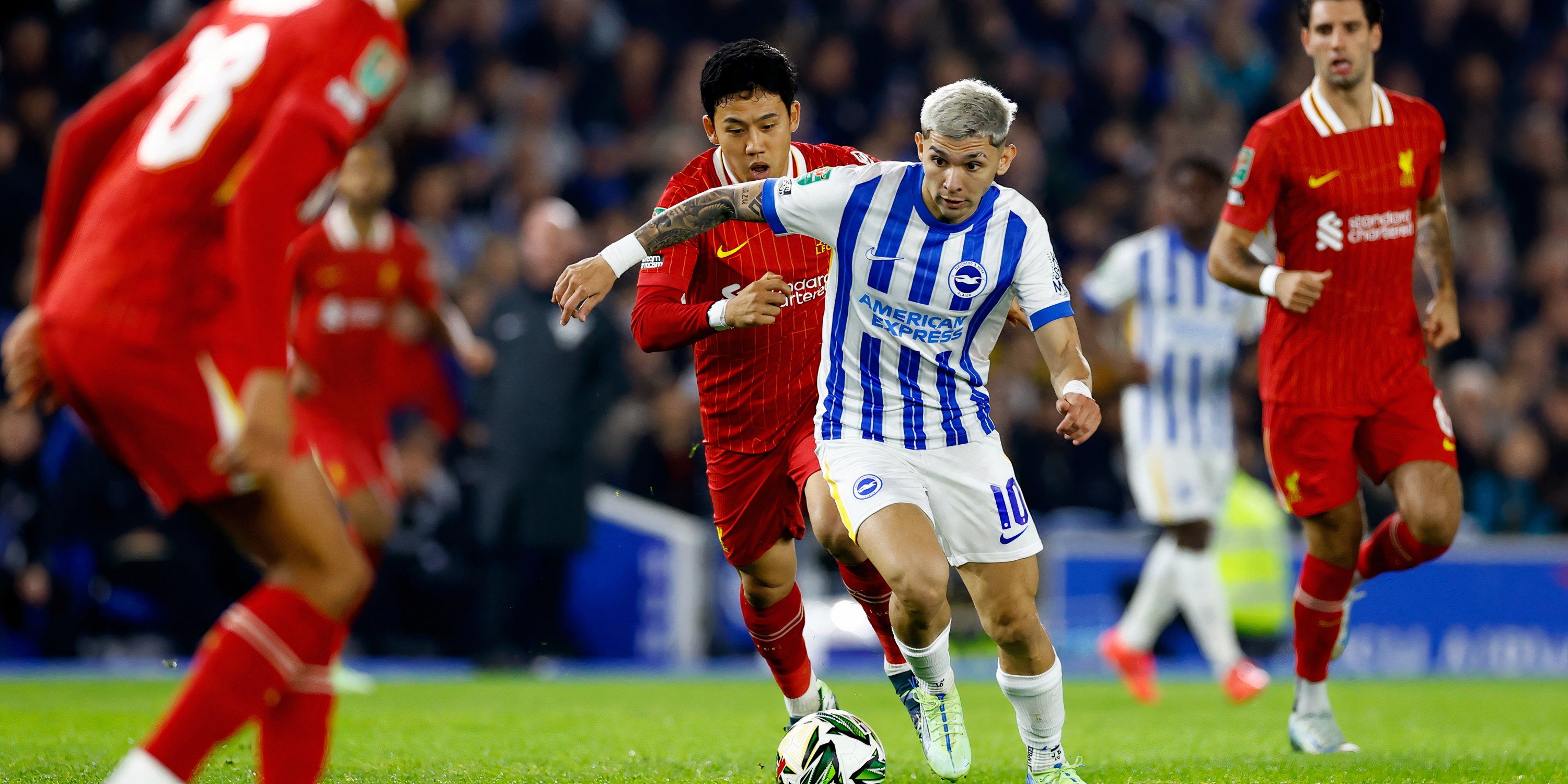 Liverpool's Wataru Endo chases Julio Enciso