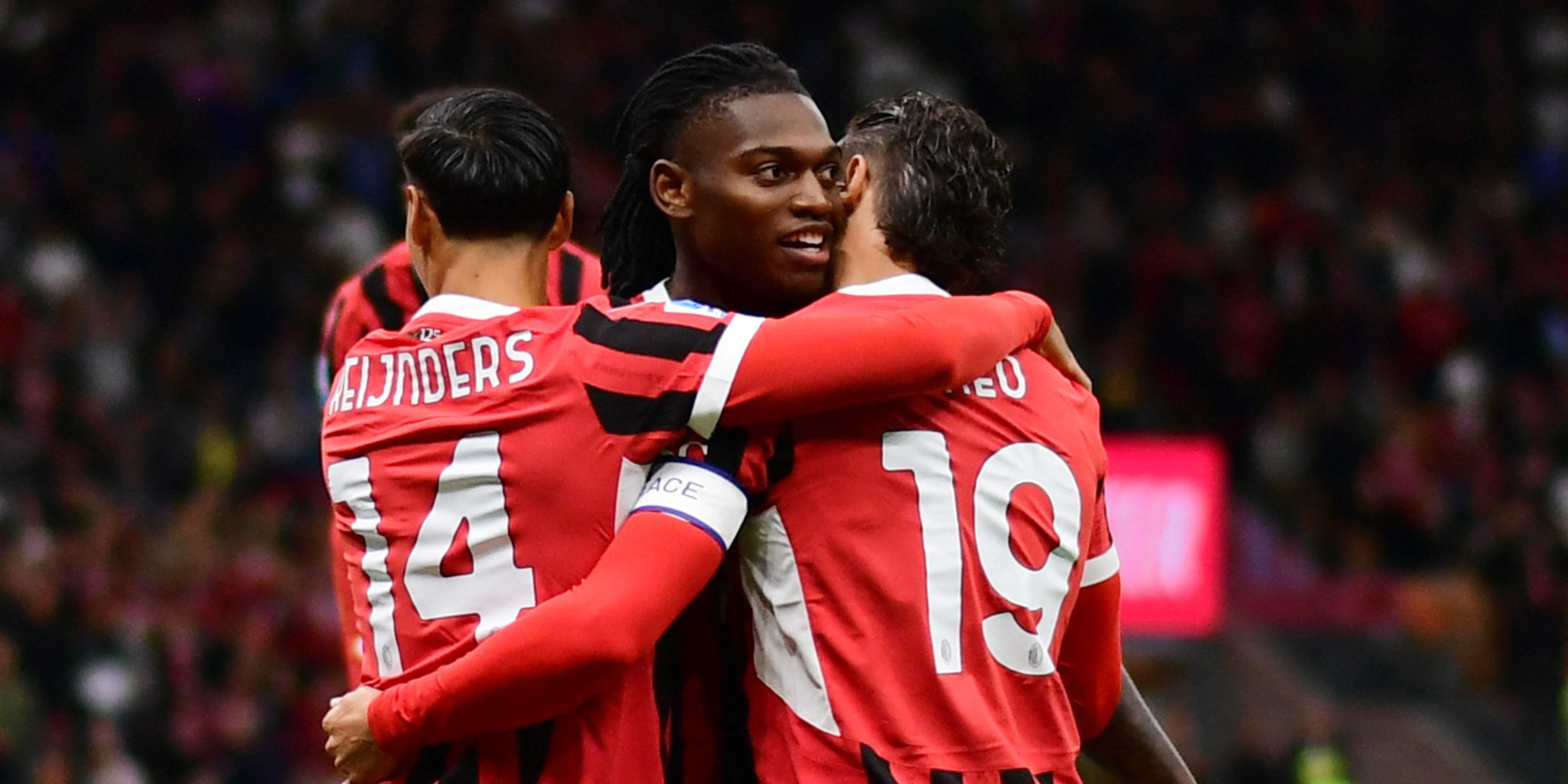 AC Milan's Theo Hernandez celebrates scoring their first goal with Rafael Leao and Tijjani Reijnders.