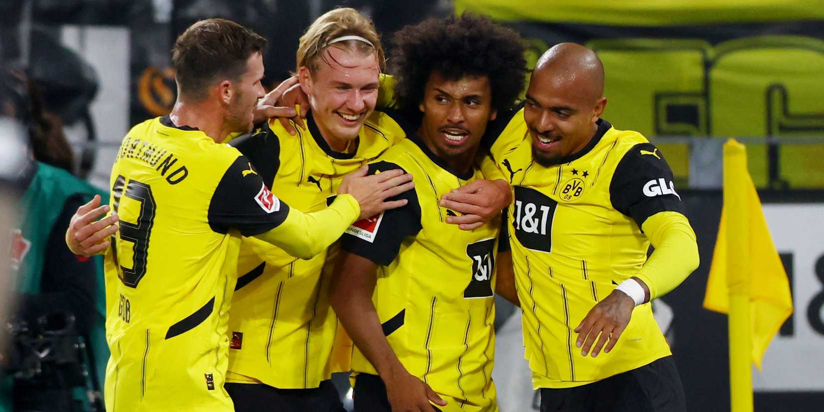 Borussia Dortmund's Karim Adeyemi celebrates scoring their second goal with Donyell Malen, Julian Brandt and Pascal Gross