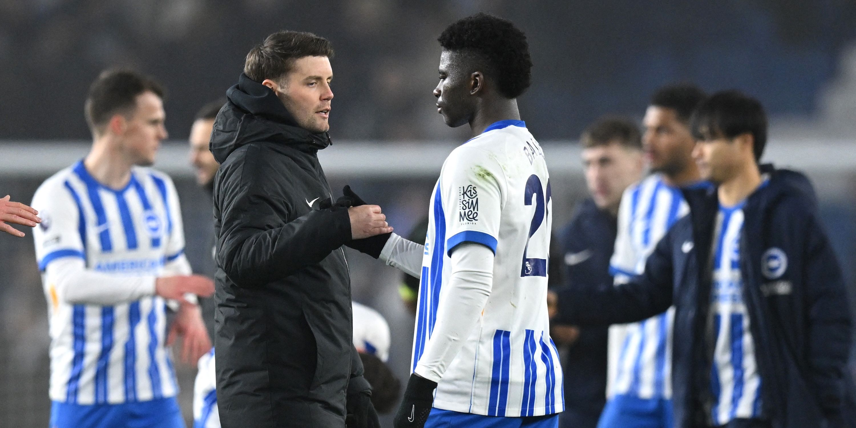 Brighton & Hove Albion manager Fabian Hurzeler shakes hands with Carlos Baleba