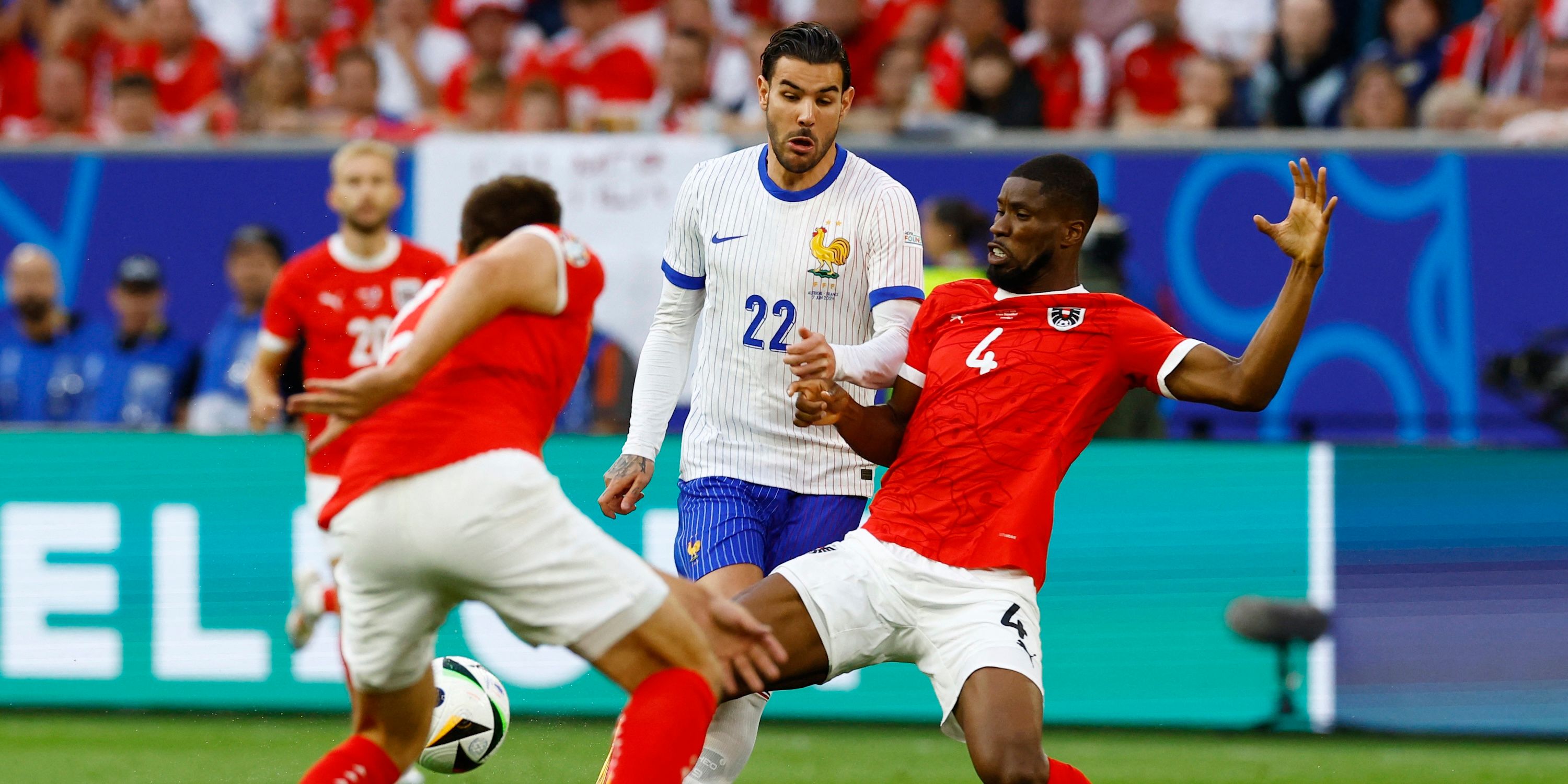 France's Theo Hernandez competes with Austria's Kevin Danso