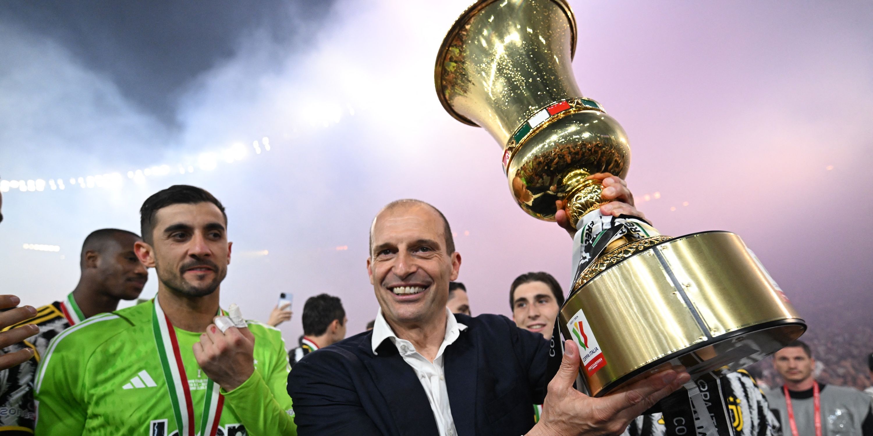 Juventus coach Massimiliano Allegri celebrates with the trophy after winning the Coppa Italia final