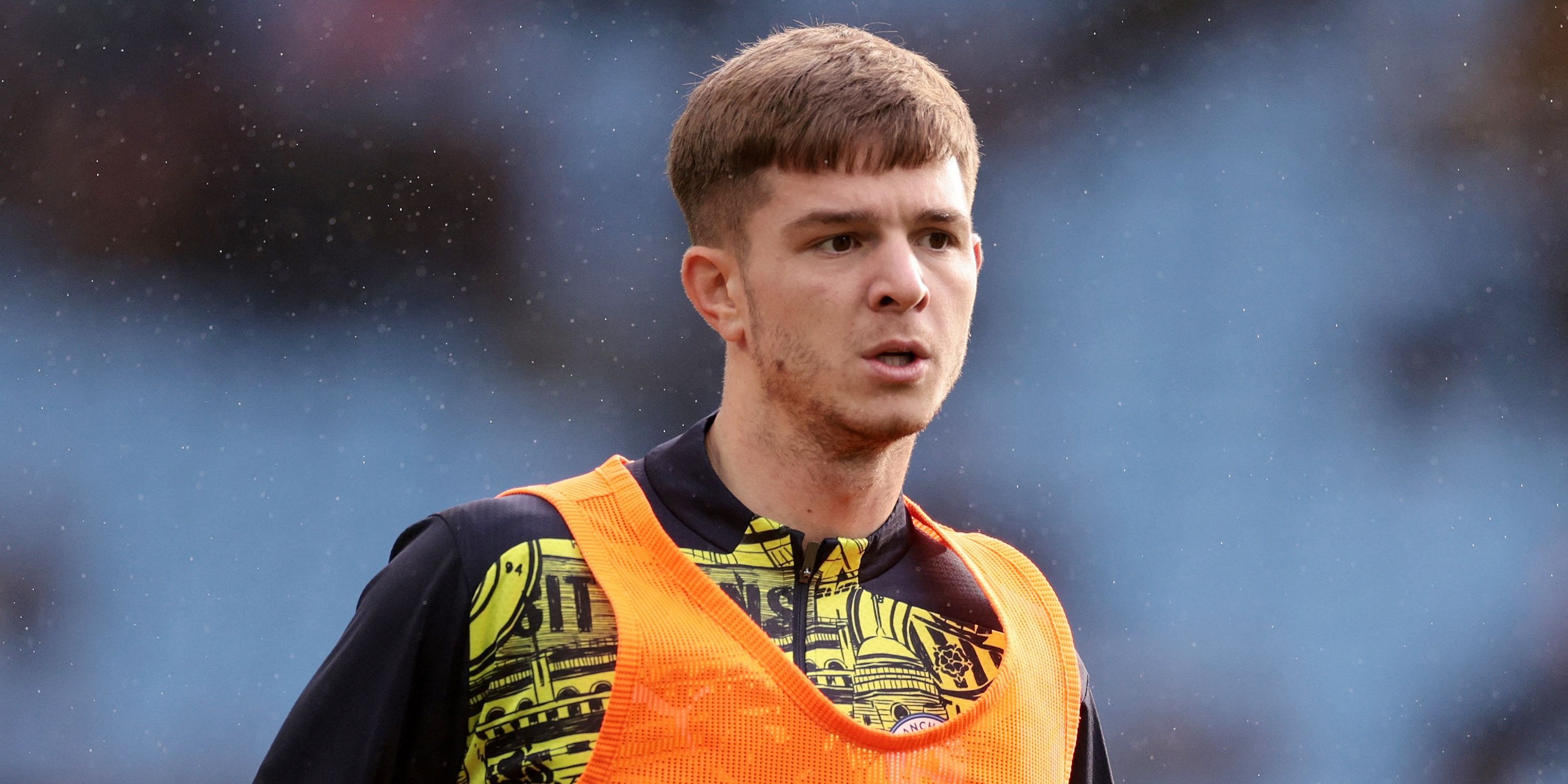 Manchester City player James McAtee warming up before the match