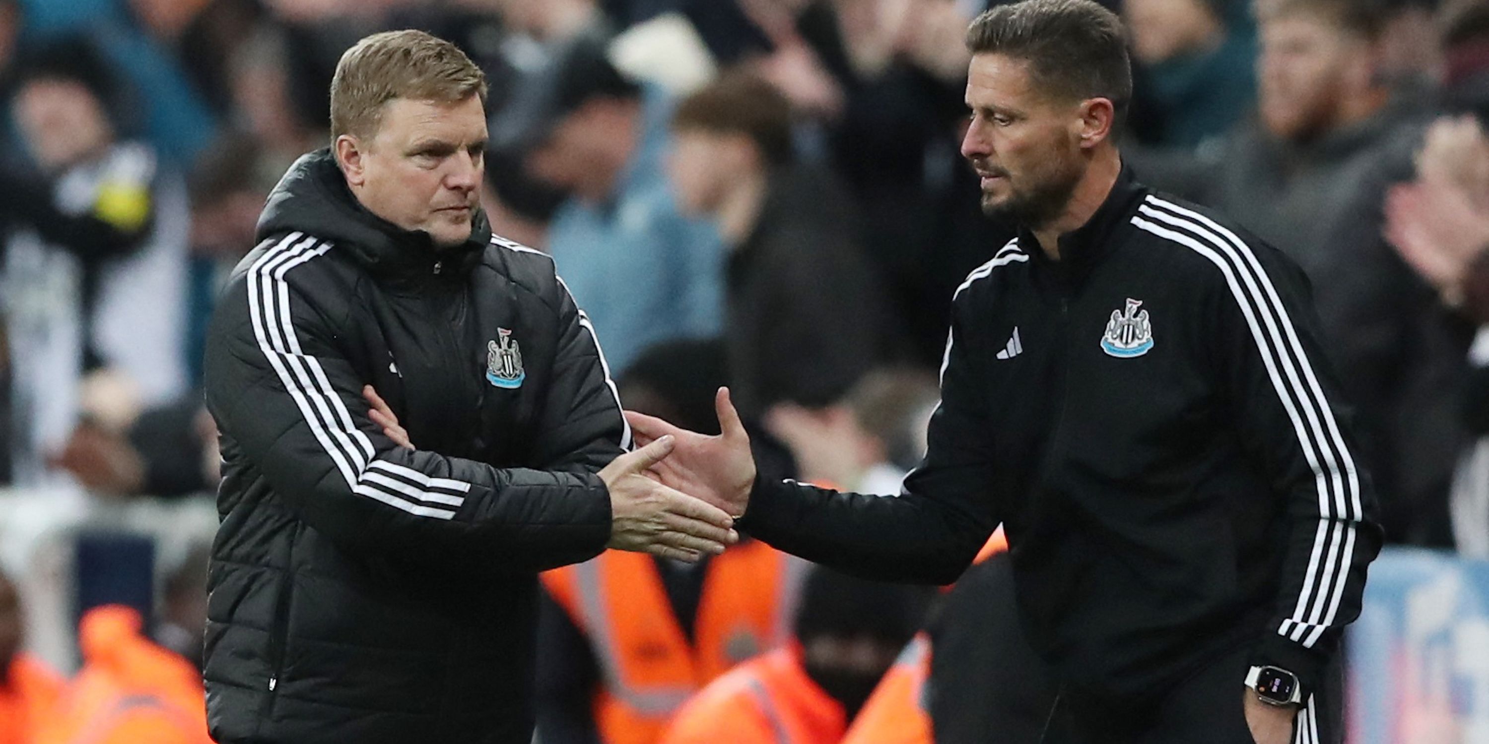 Newcastle United manager Eddie Howe shakes hands with assistant manager Jason Tindall after the match