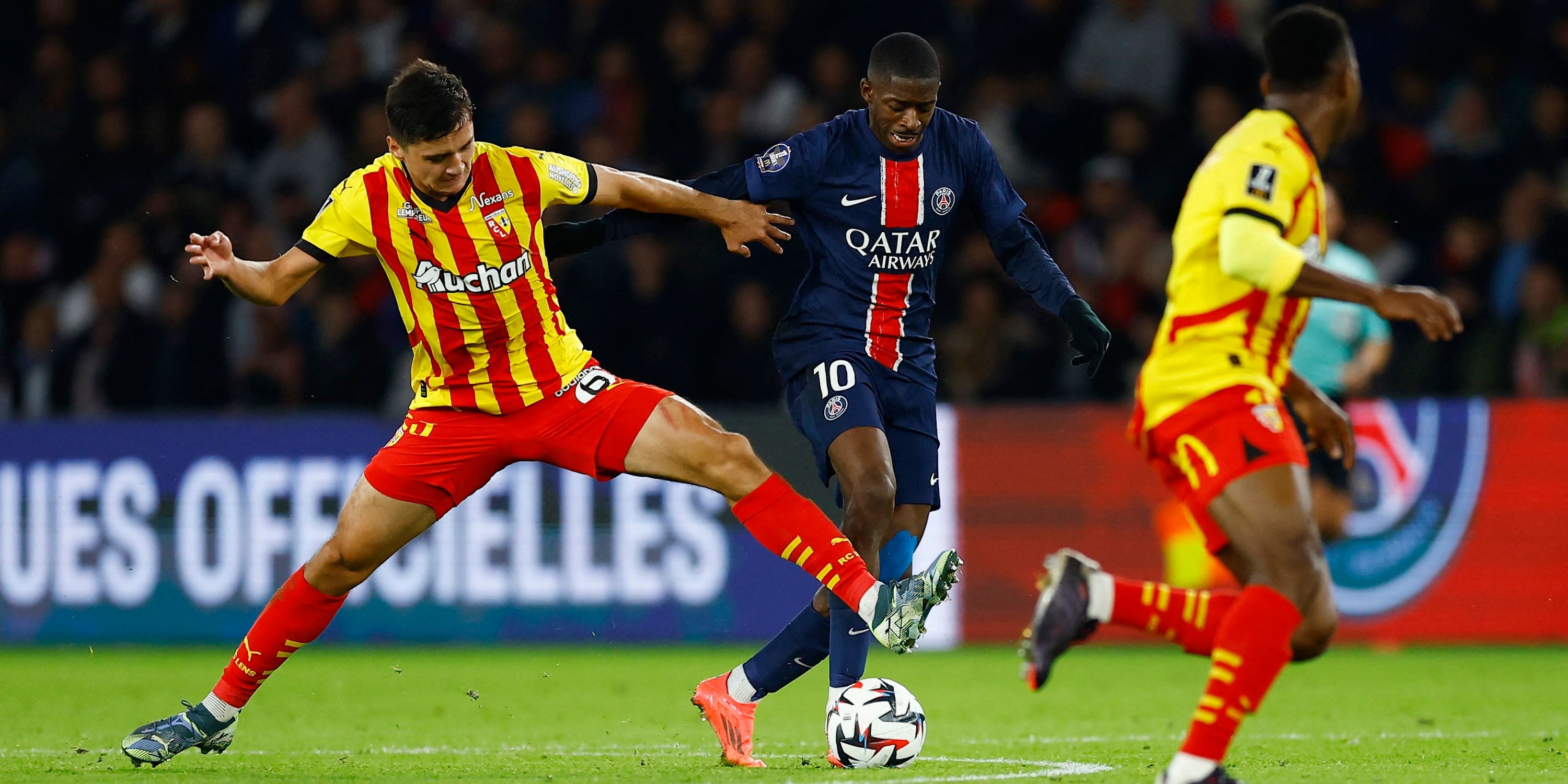 Ousmane Dembélé, Paris Saint-Germain player, in a match with Abdulkader Khosanov, RC Lens player