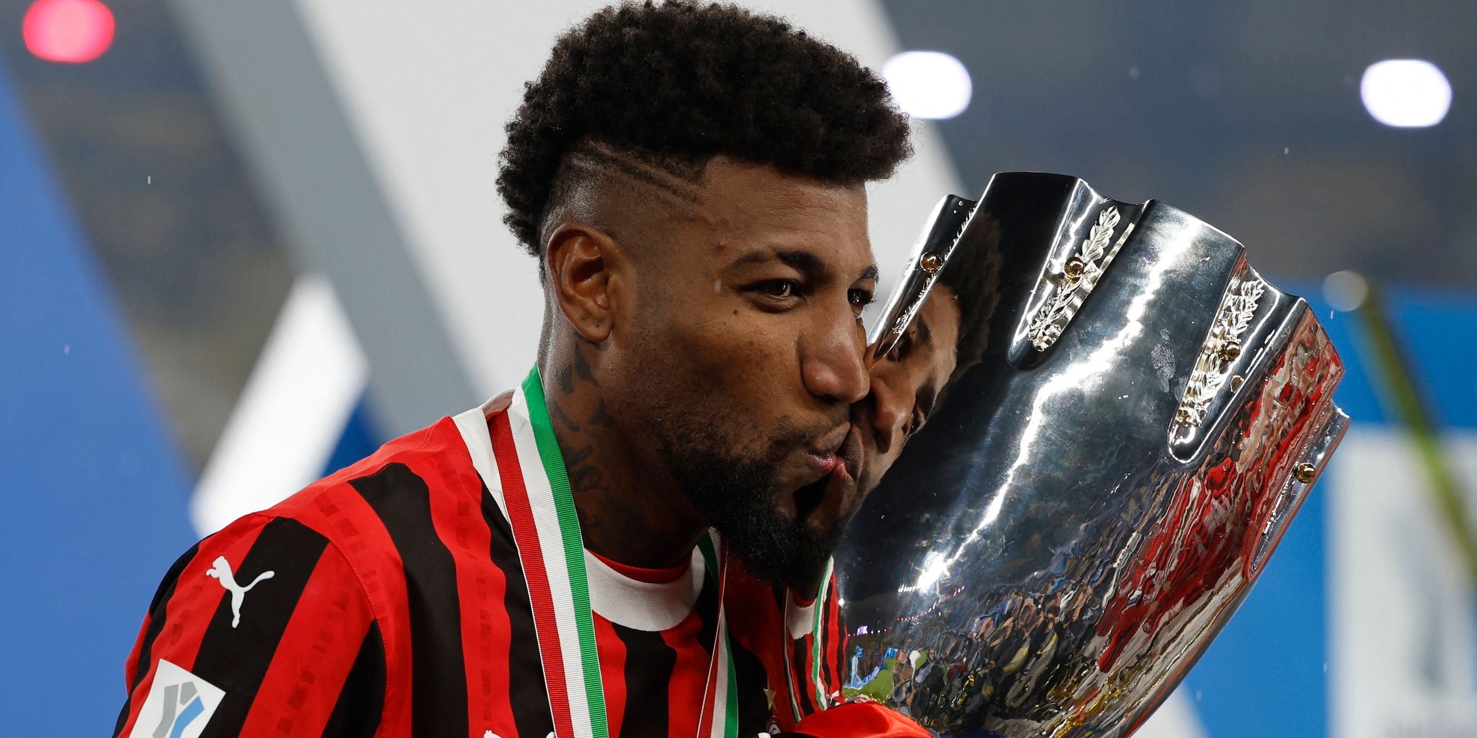 AC Milan's Emerson Royal celebrate with trophy after winning Italian Super Cup