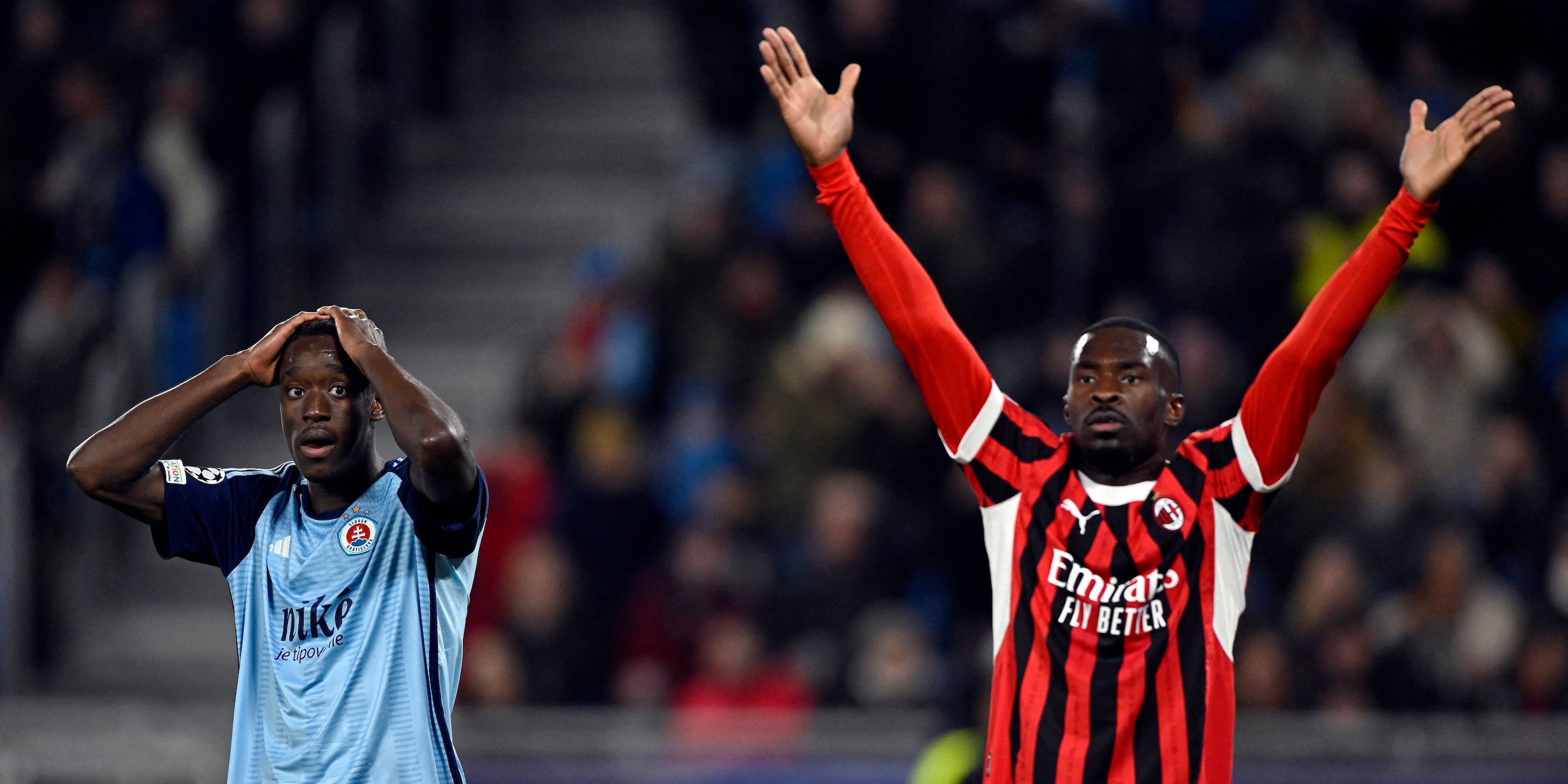 AC Milan's Fikayo Tomori and Slovan Bratislava's Idjessi Metoko react