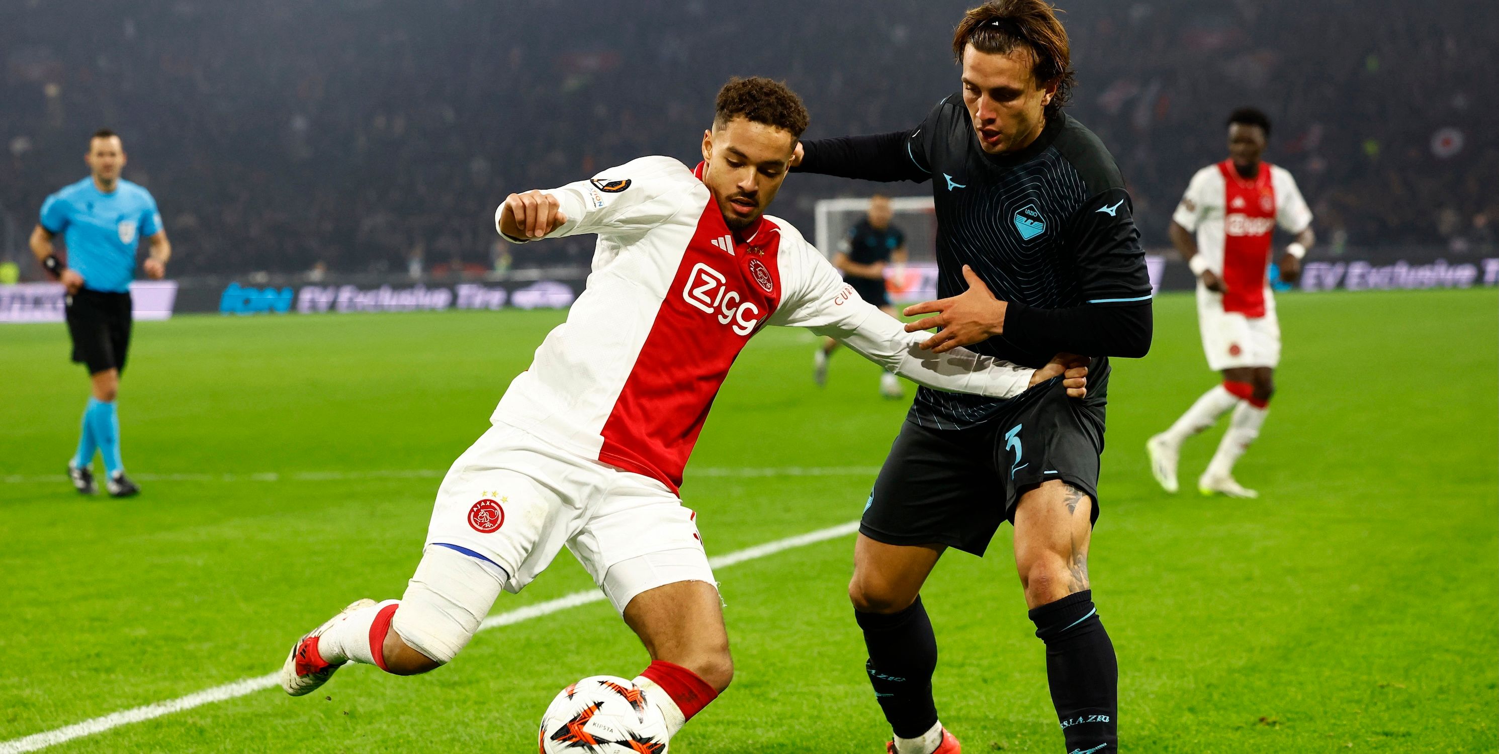 Ajax Amsterdam's Devyne Rensch in action with Lazio's Luca Pellegrini