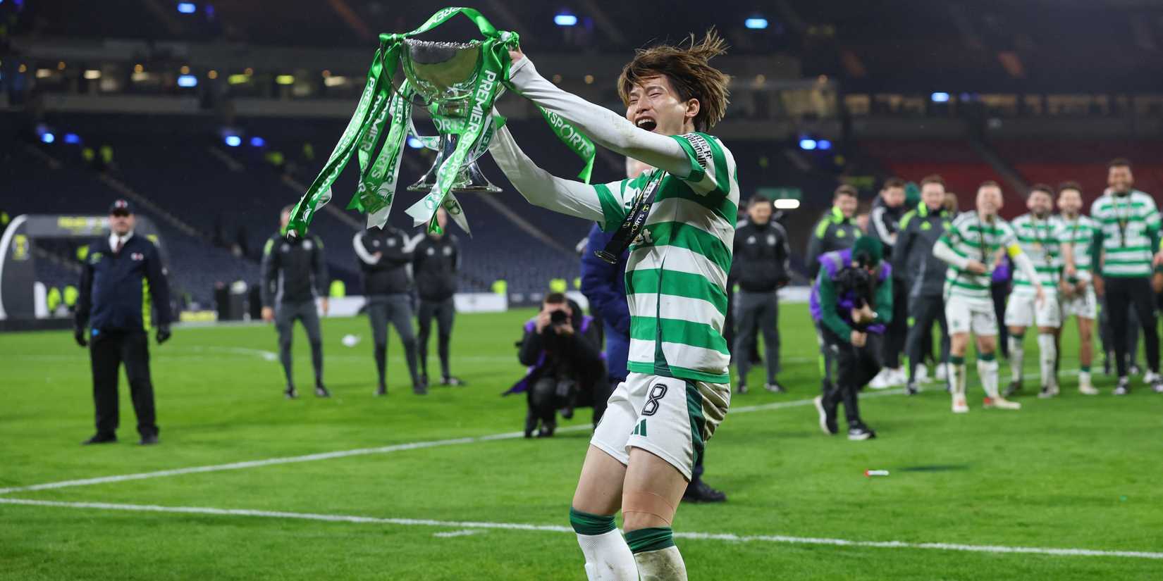 Celtic's Kyogo Furuhashi celebrates with the trophy after winning the League Cup