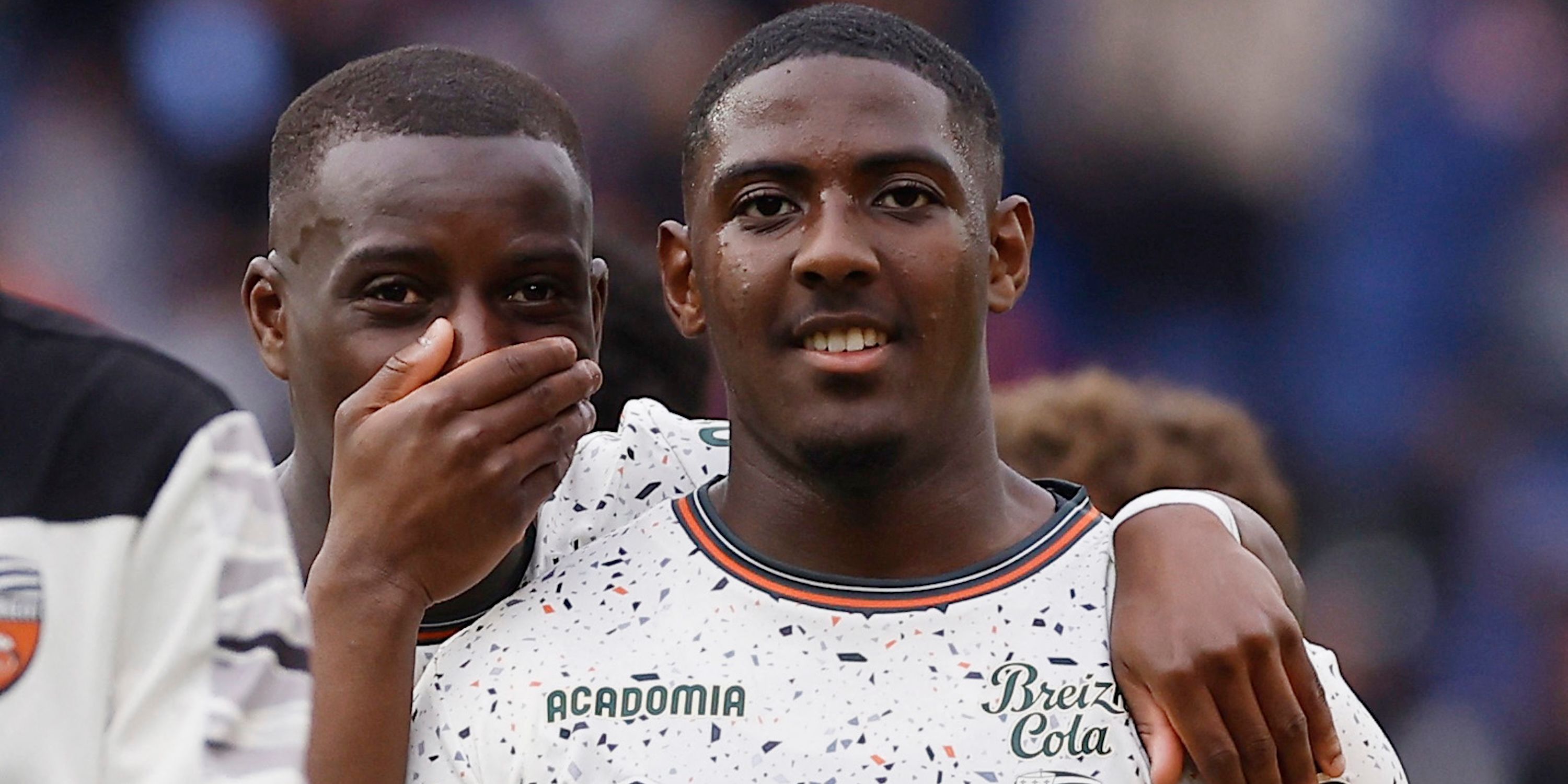 FC Lorient's Yoann Cathline and Ayman Kari celebrate after the match