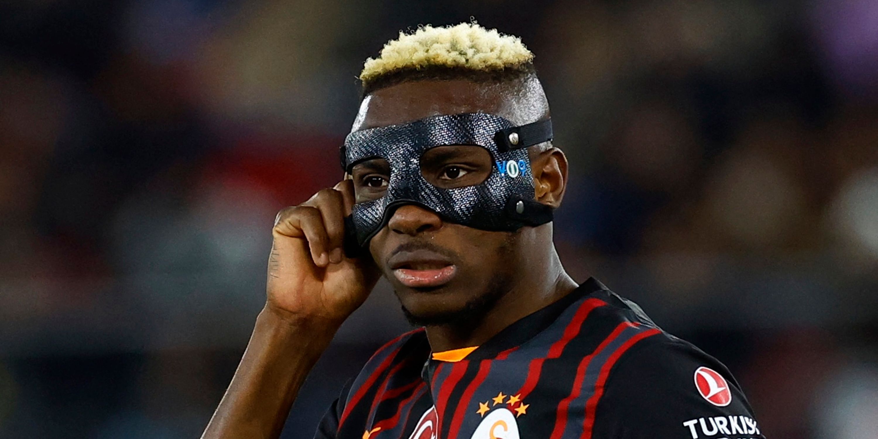 Galatasaray's Victor Osimhen is a picture wearing a protective face mask