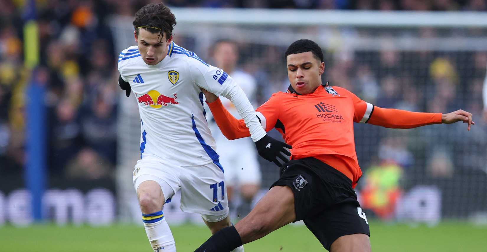 Leeds United's Brenden Aaronson in action with Sheffield Wednesday's Shea Charles