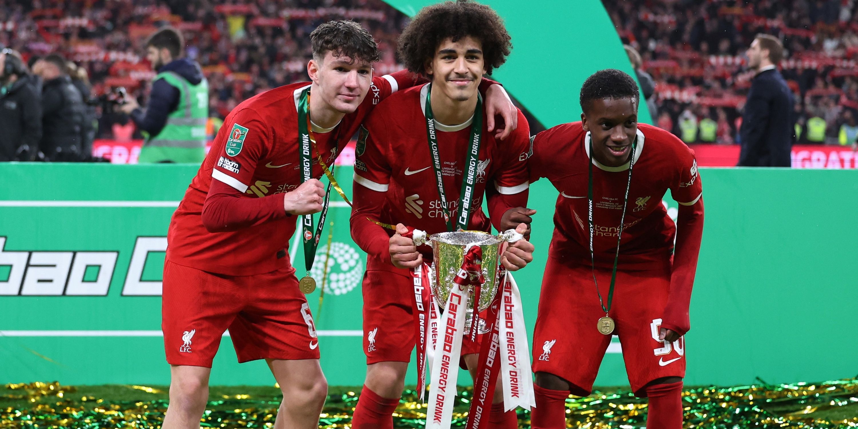 Liverpool's Lewis Koumas, Jayden Danns and Trey Nyoni celebrate winning the Carabao Cup with the trophy