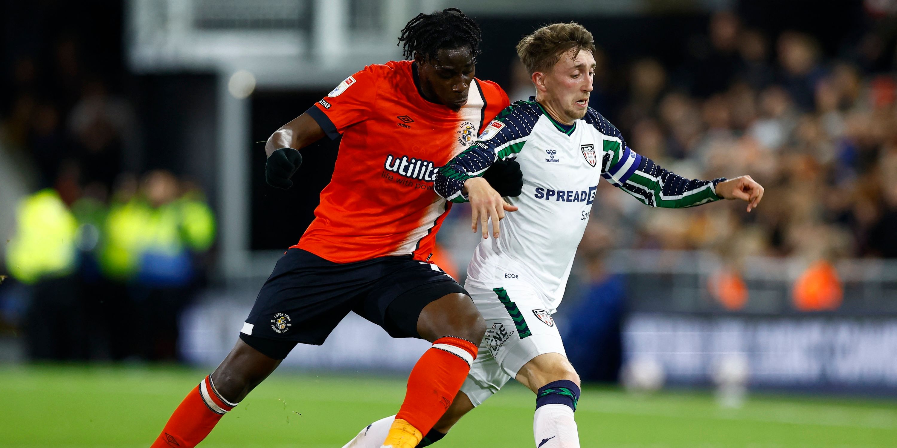 Luton Town's Elijah Adebayor vs Sunderland's Daniel Neill during the match