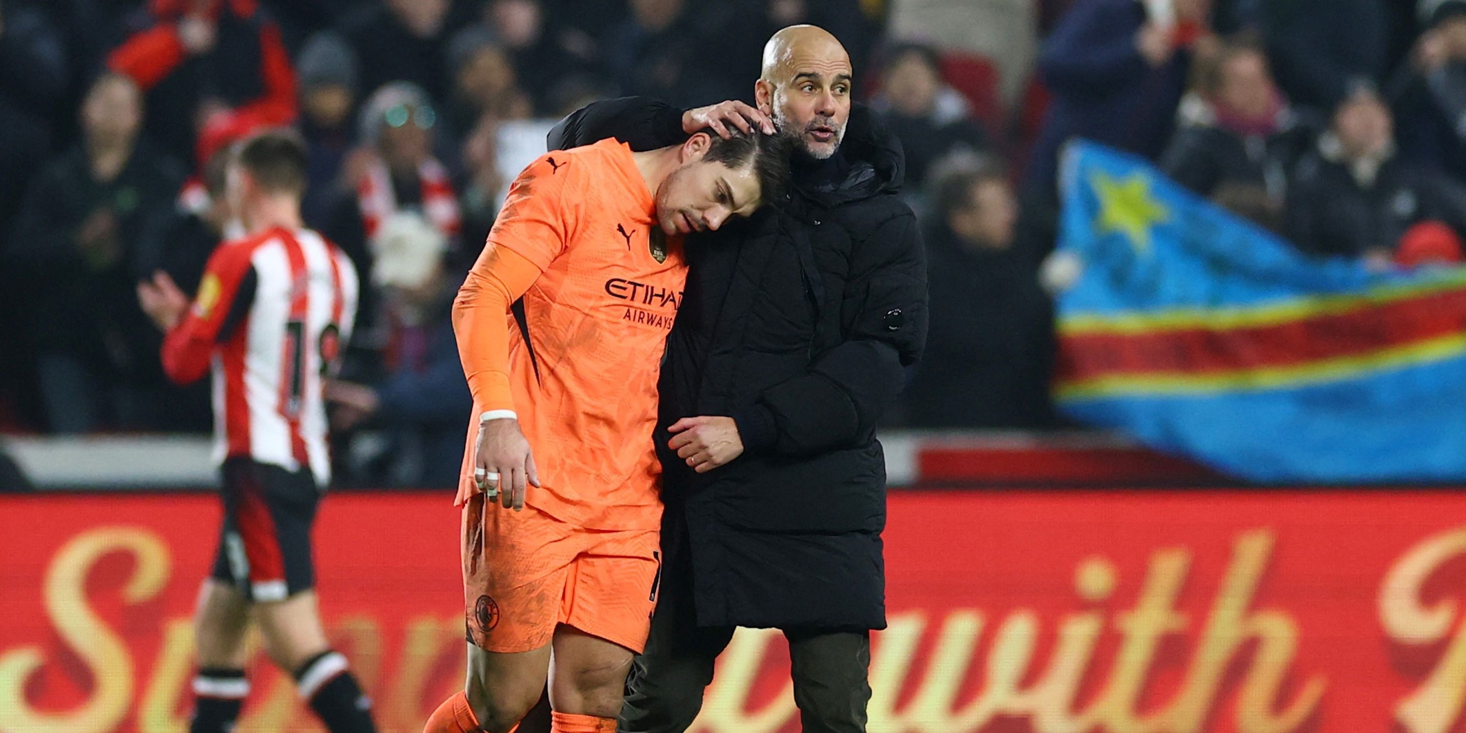 Manchester City manager Pep Guardiola consoles Stefan Ortega