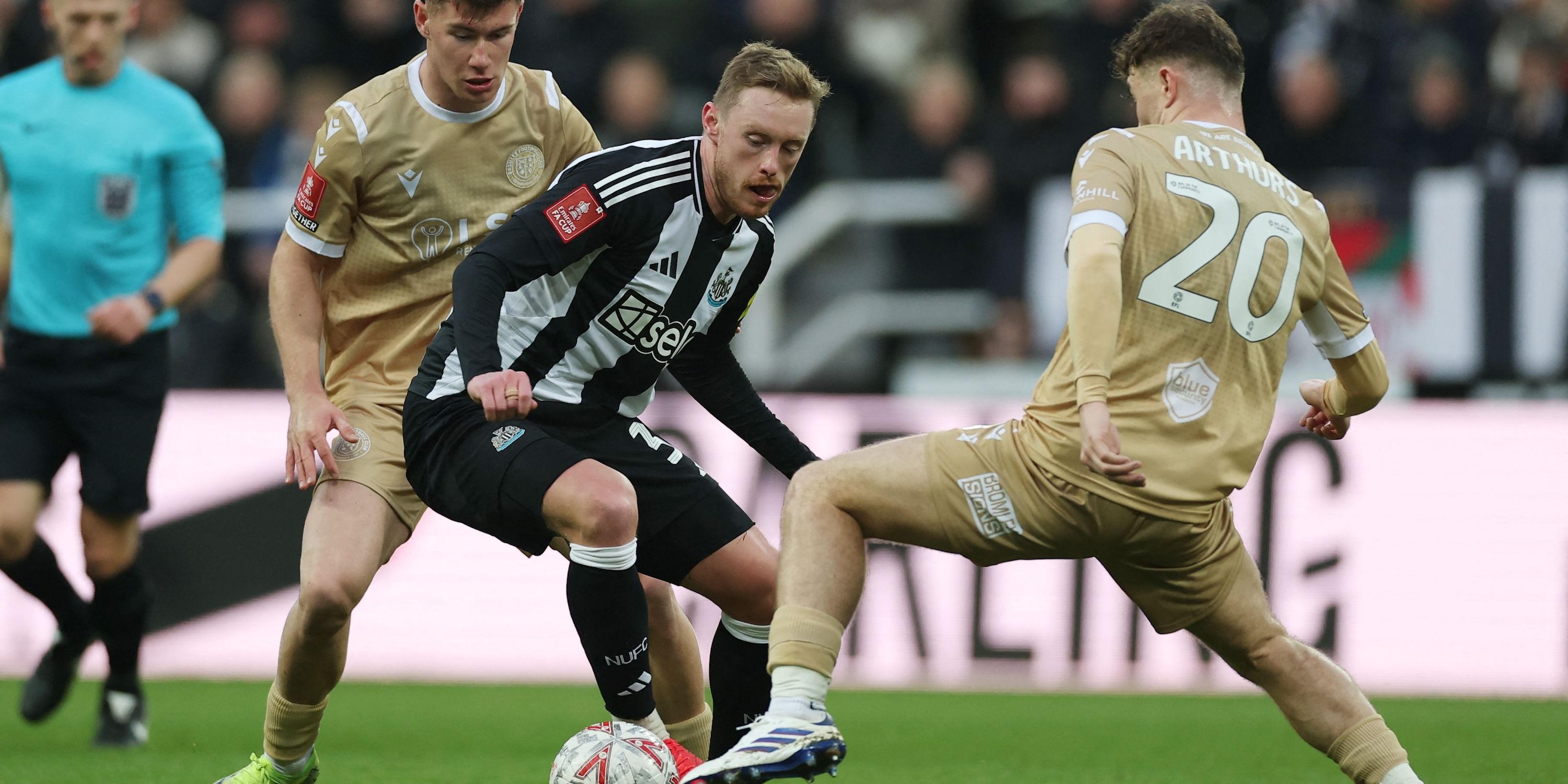 Newcastle United's Sean Longstaff in action with Bromley's Jude Arthurs