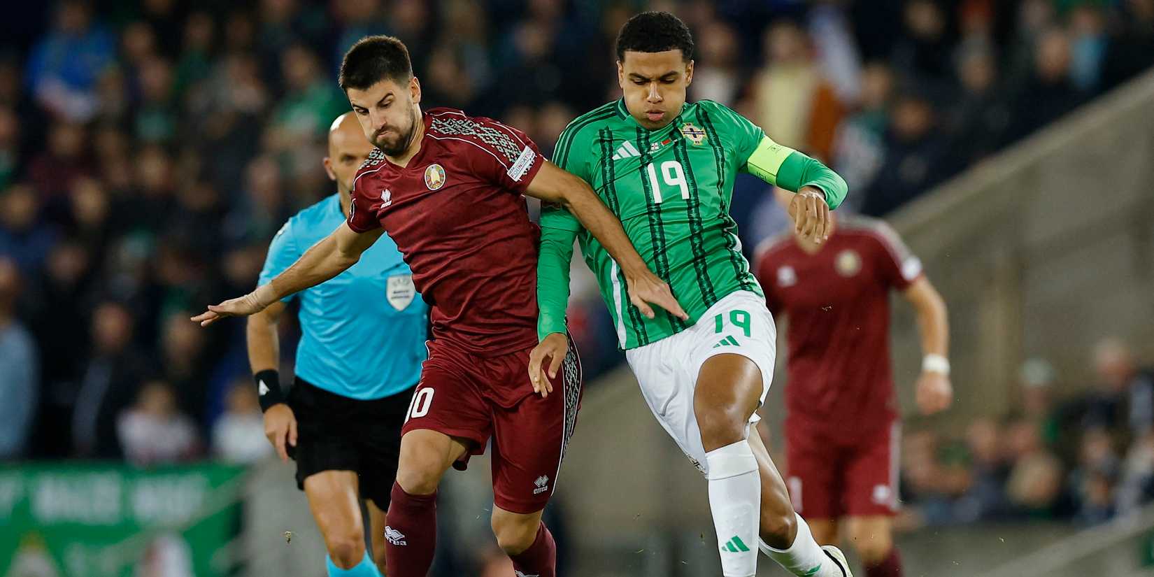Northern Ireland's Shea Charles in action with Belarus' Valeriy Gromyko