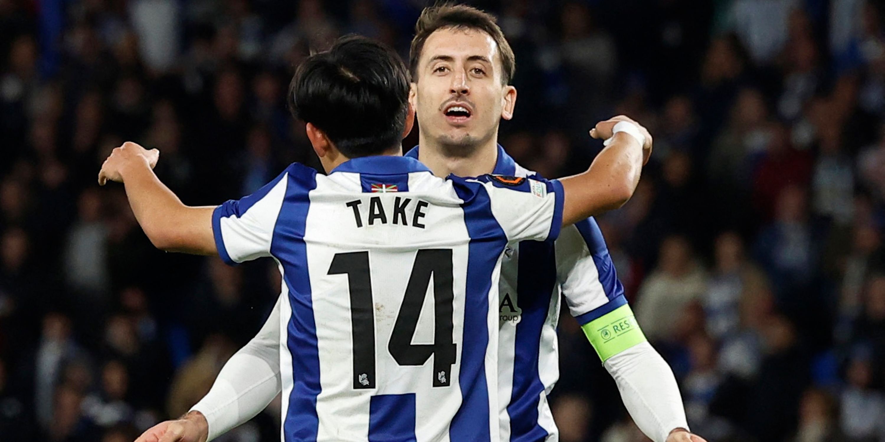 Real Sociedad player Takefusa Kubo celebrates scoring his second goal with Mikel Oyarzabal