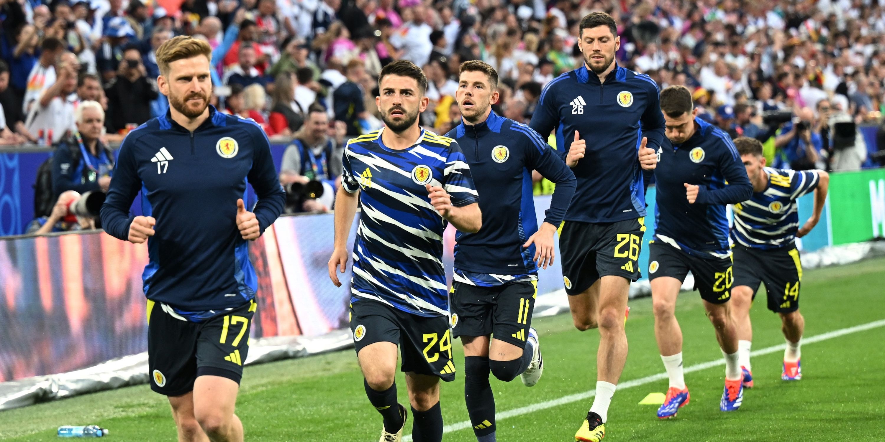 Scotland's Stuart Armstrong, Greg Taylor and teammates during the warm up before the match