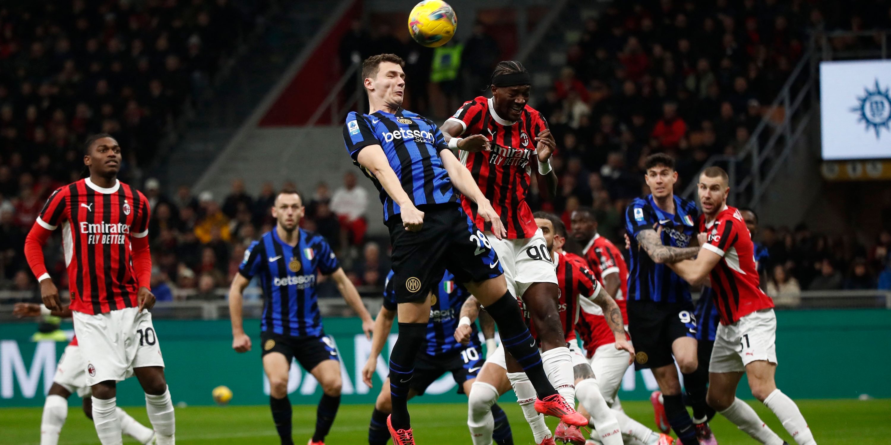 AC Milan's Tammy Abraham in action with Inter Milan's Benjamin Pavard 