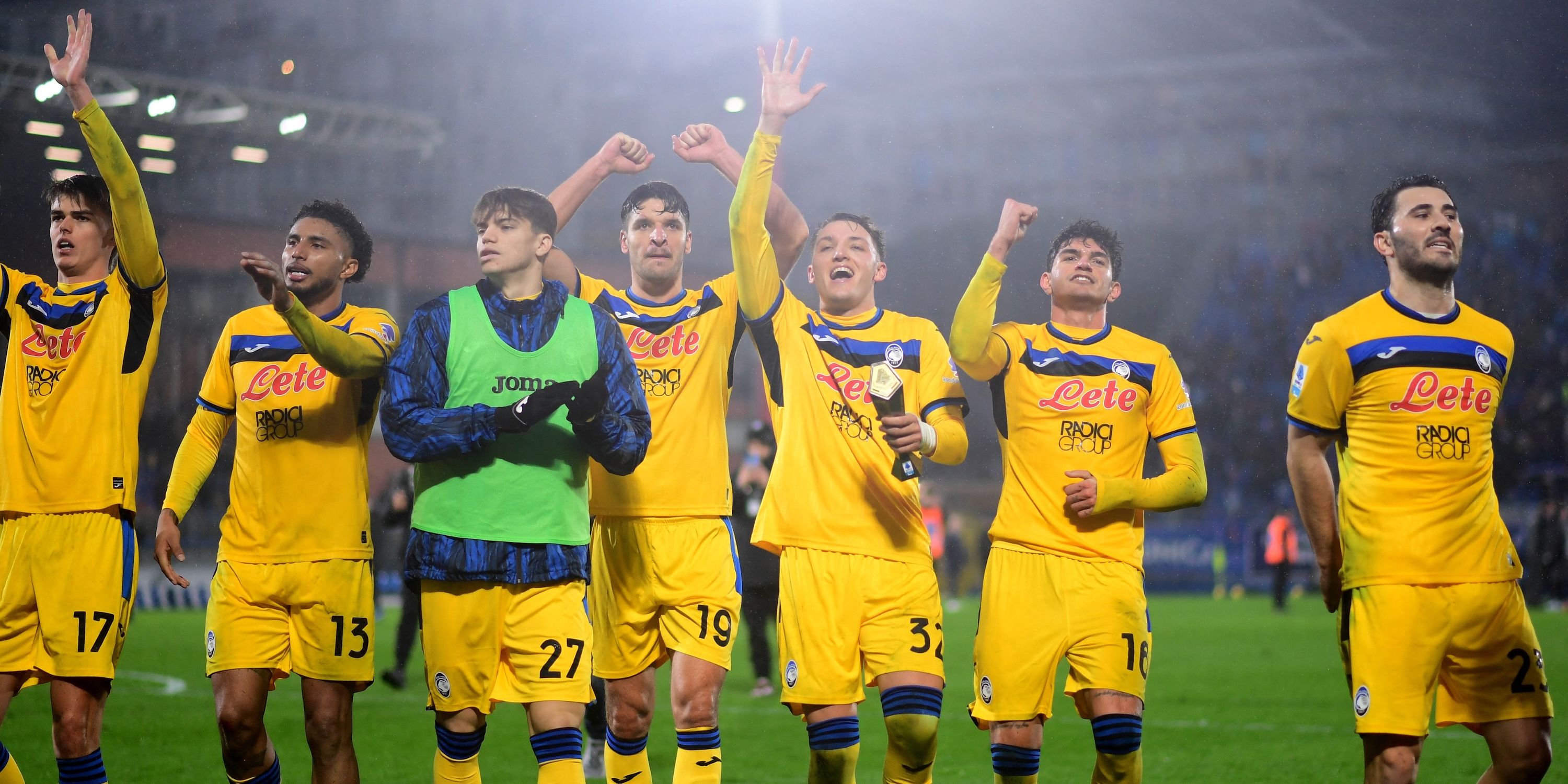 Atalanta's Mateo Retegui and teammates celebrate with fans after the match