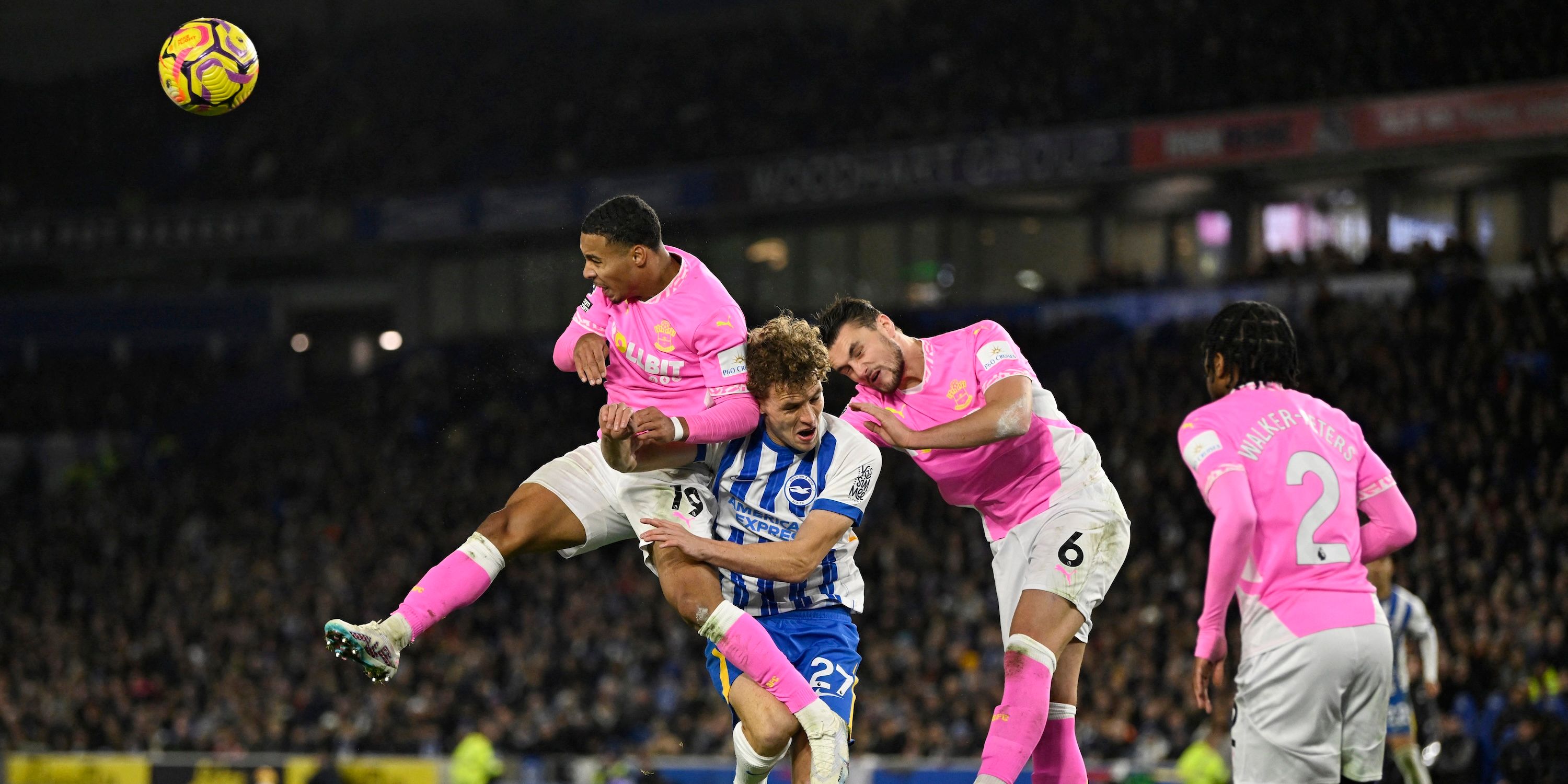 Brighton & Hove Albion's Mats Wieffer in action with Southampton's Cameron Archer and Taylor Harwood-Bellis