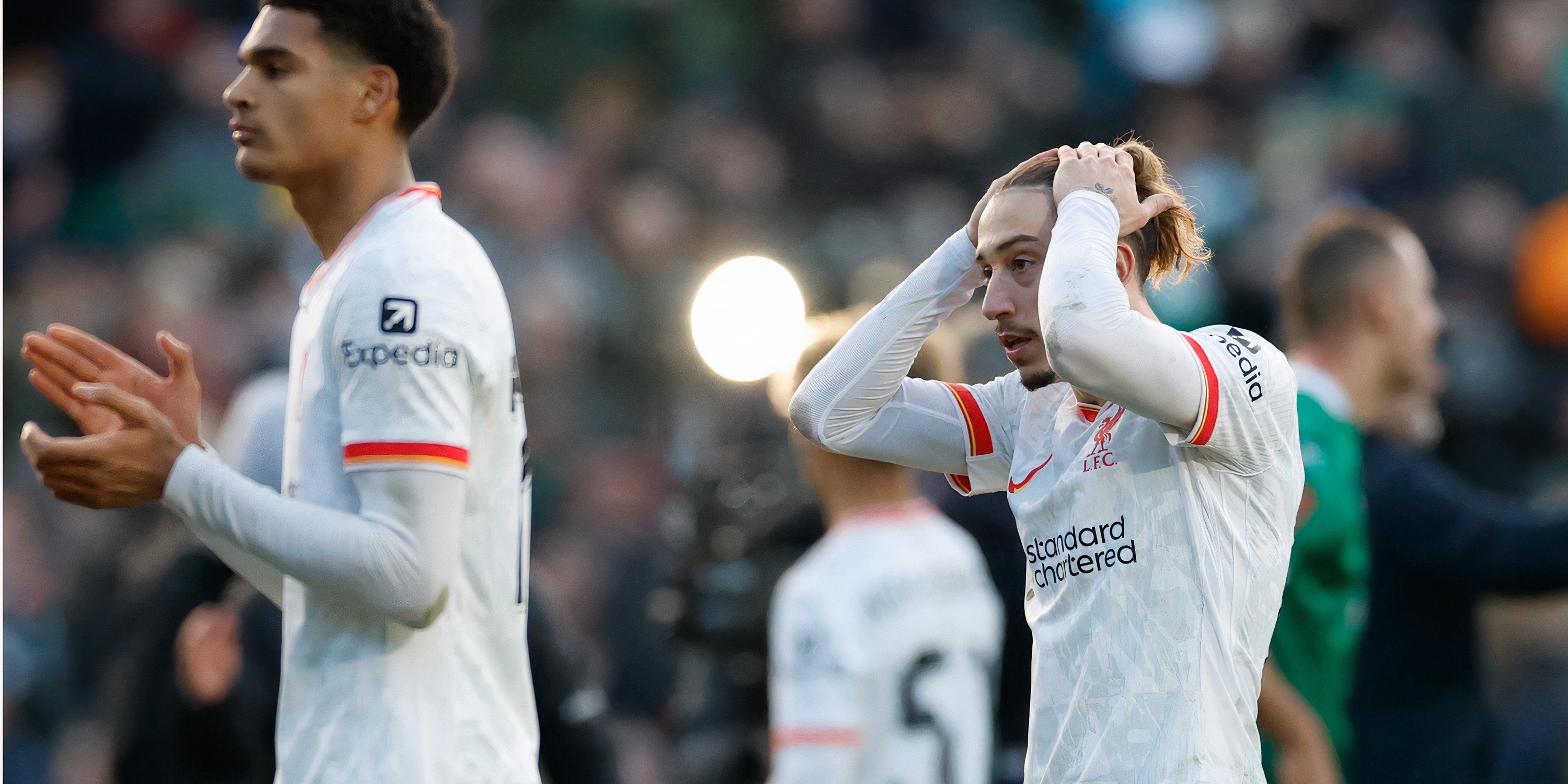 Kostas Tsimikas and Jarell Quansah look dismayed for Liverpool