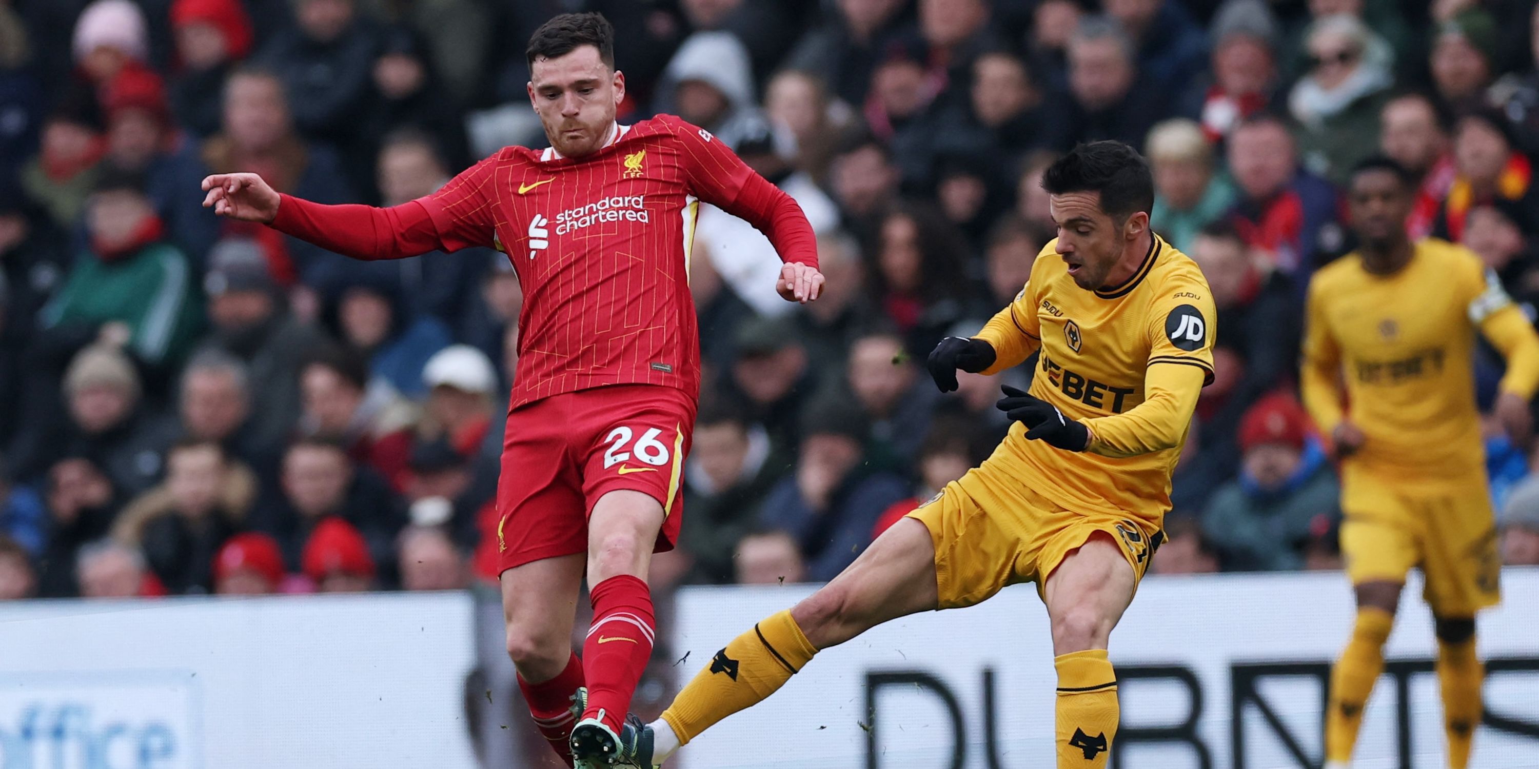 Liverpool's Andrew Robertson in action with Wolverhampton Wanderers' Pablo Sarabia