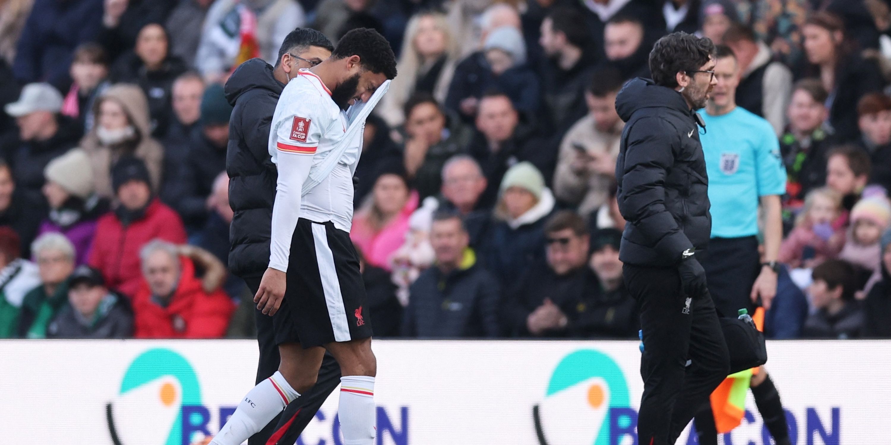 Liverpool's Joe Gomez walks off the pitch after sustaining an injury