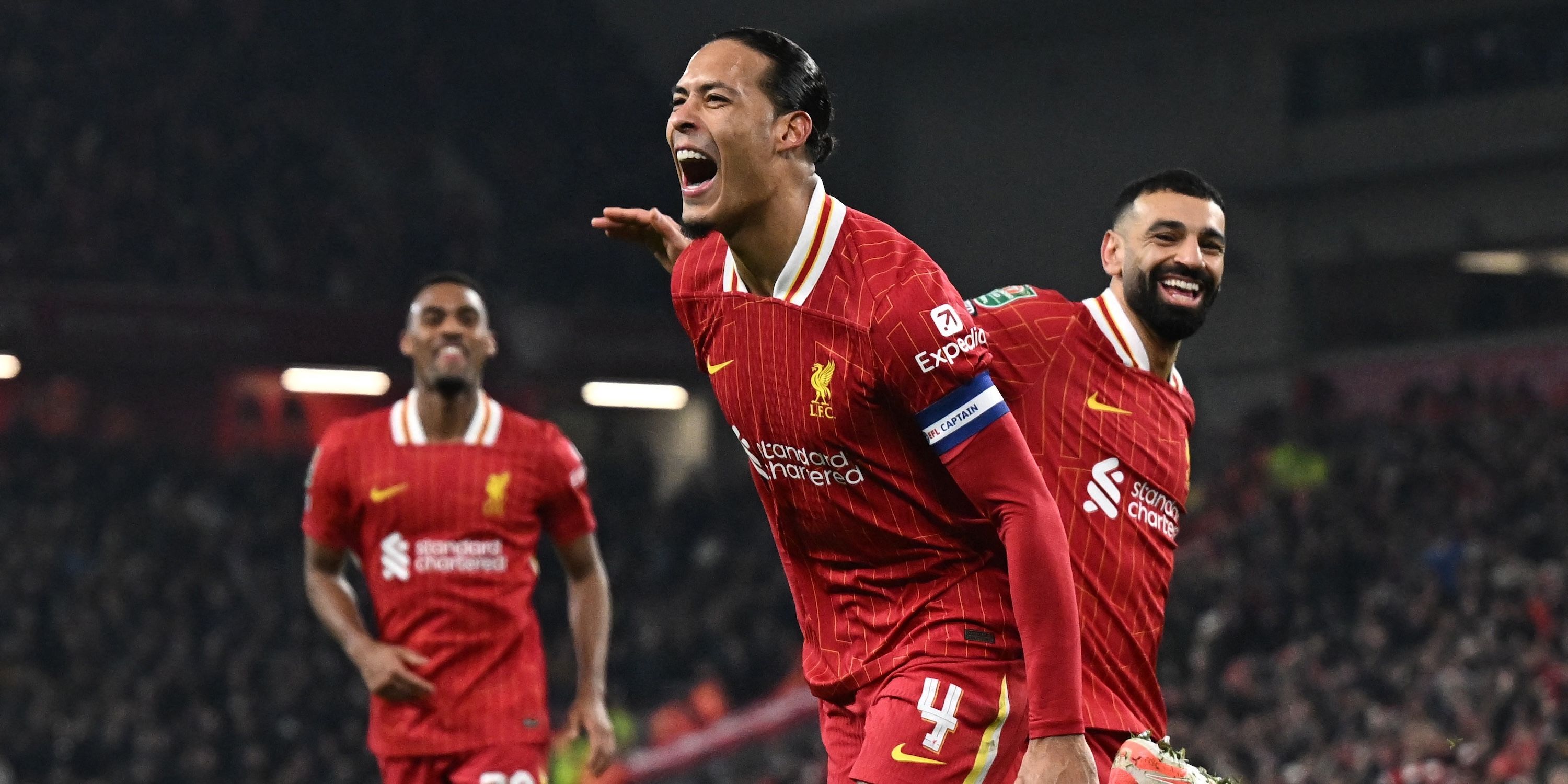 Virgil Van Dick from Liverpool celebrates his fourth goal with Mohamed Salah 