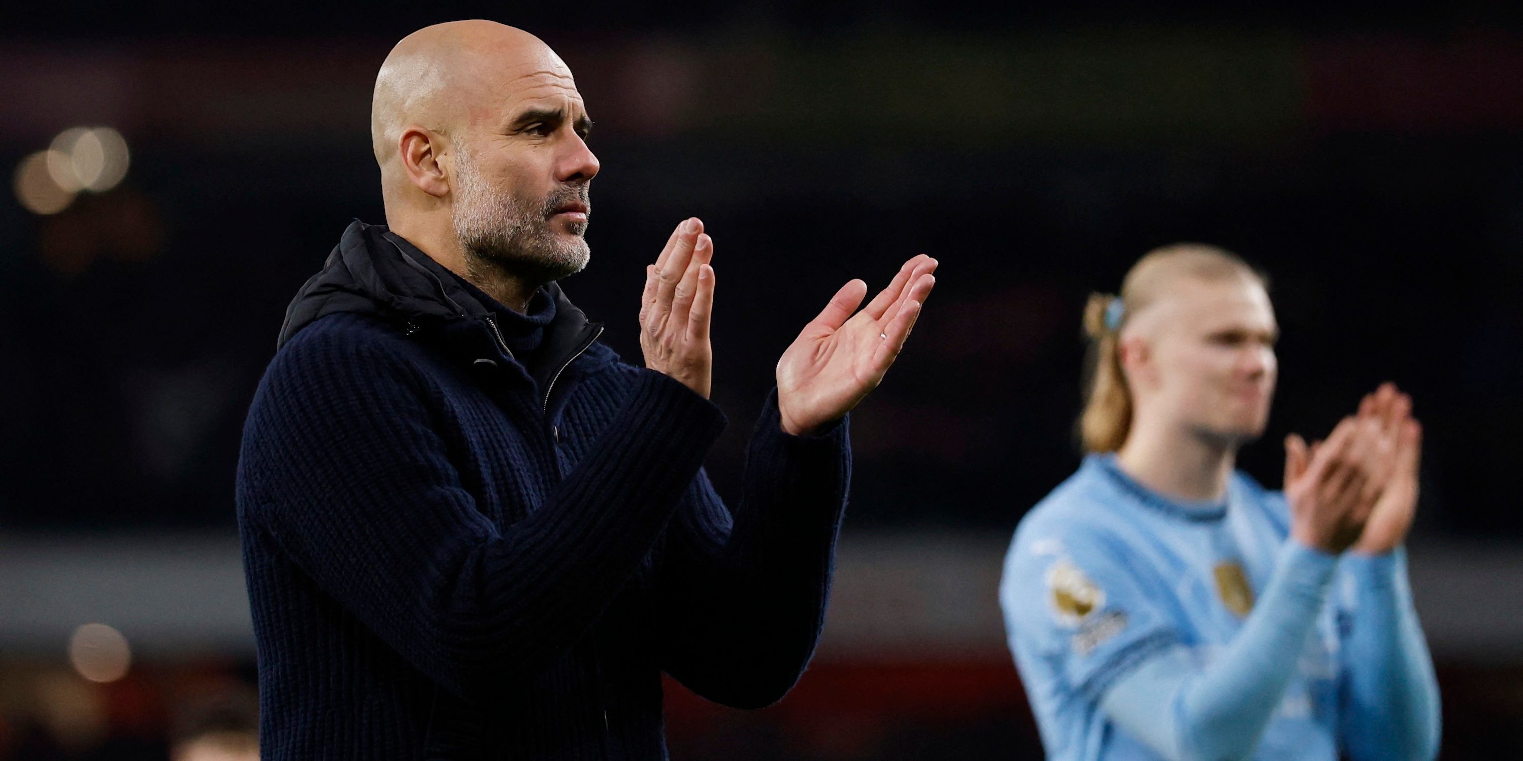 Manchester City Manager Pep Guardiola and Erling Haaland