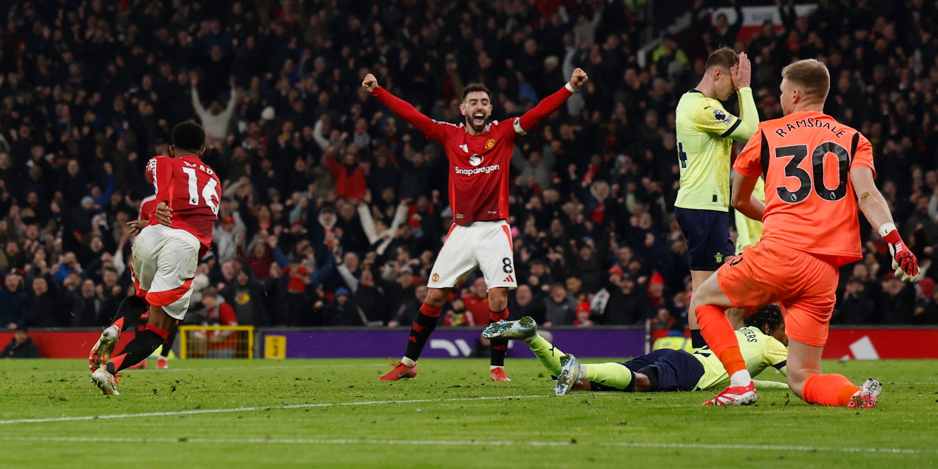 Manchester United's Amad Diallo celebrates scores their second goal with Bruno Fernandes