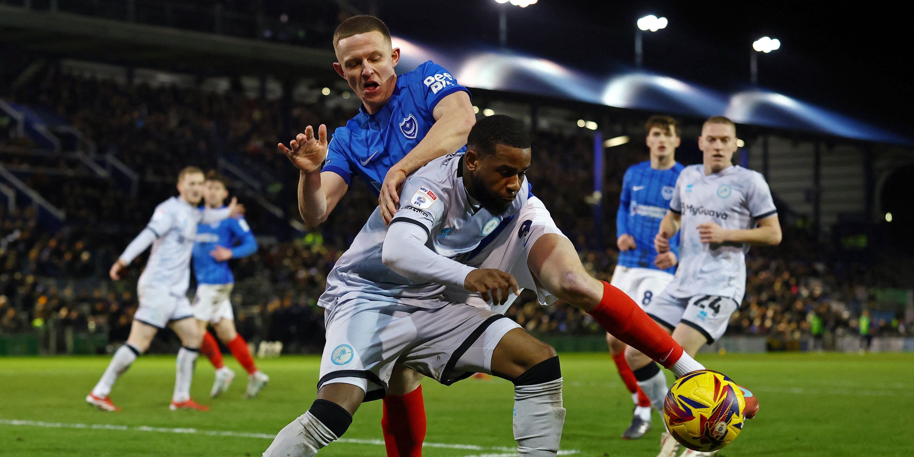 Portsmouth's Colby Bishop in action with Millwall's Japhet Tanganga