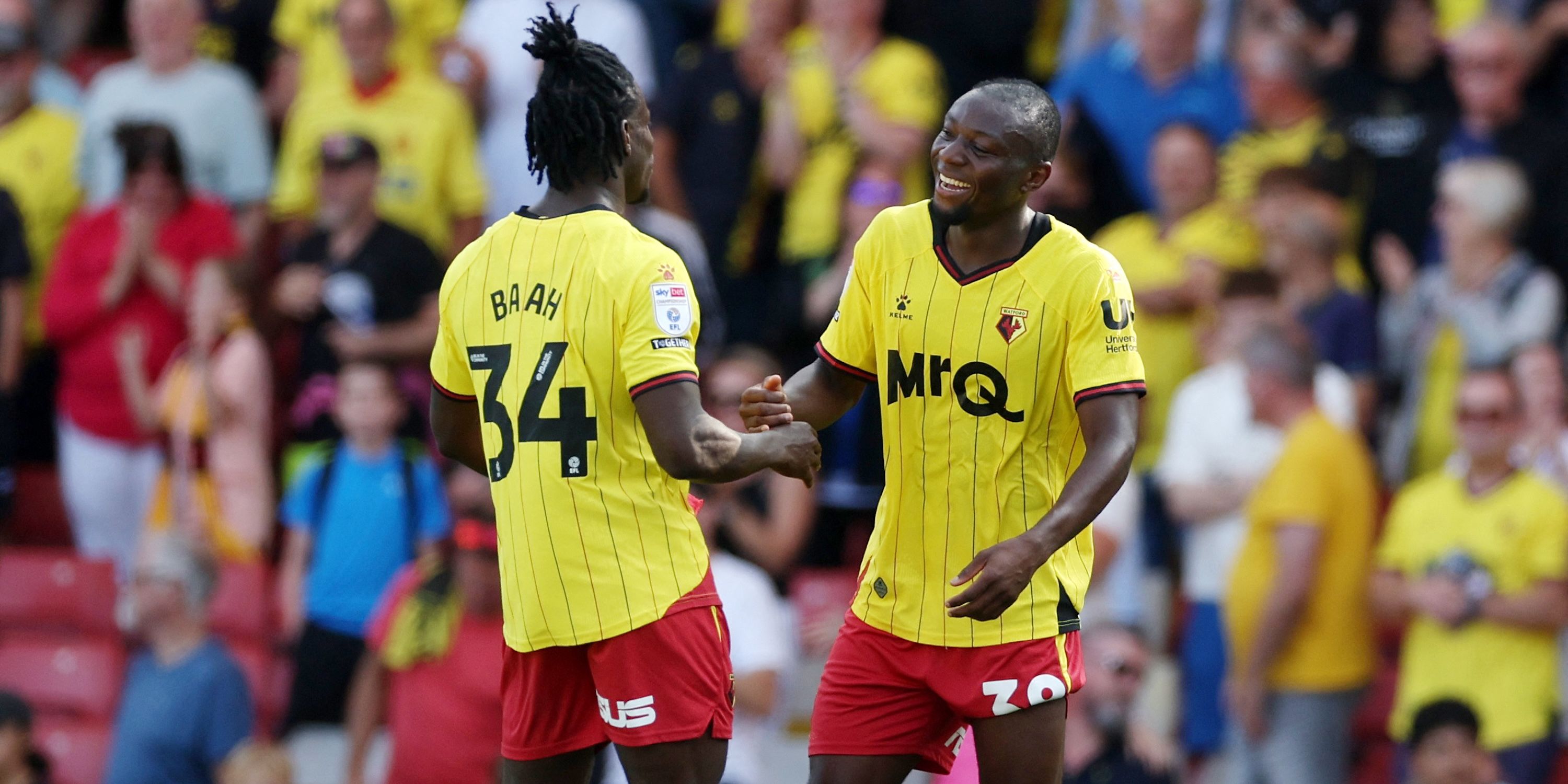 Watford's Kwadwo Baah and Odo Kayembe celebrate after the race 