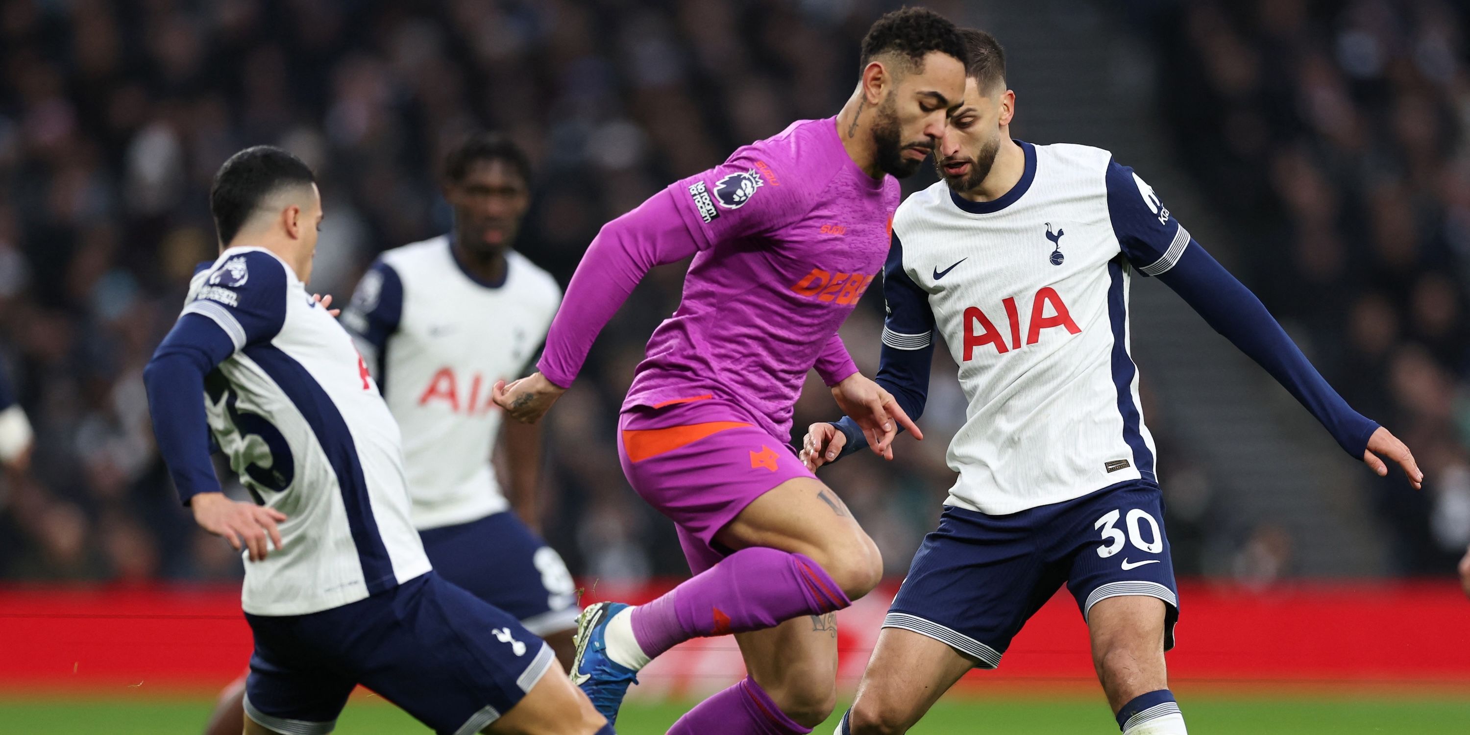 Wolverhampton Wanderers' Matheus Cunha in action with Tottenham Hotspur's Pedro Porro and Tottenham Hotspur's Rodrigo Bentancur