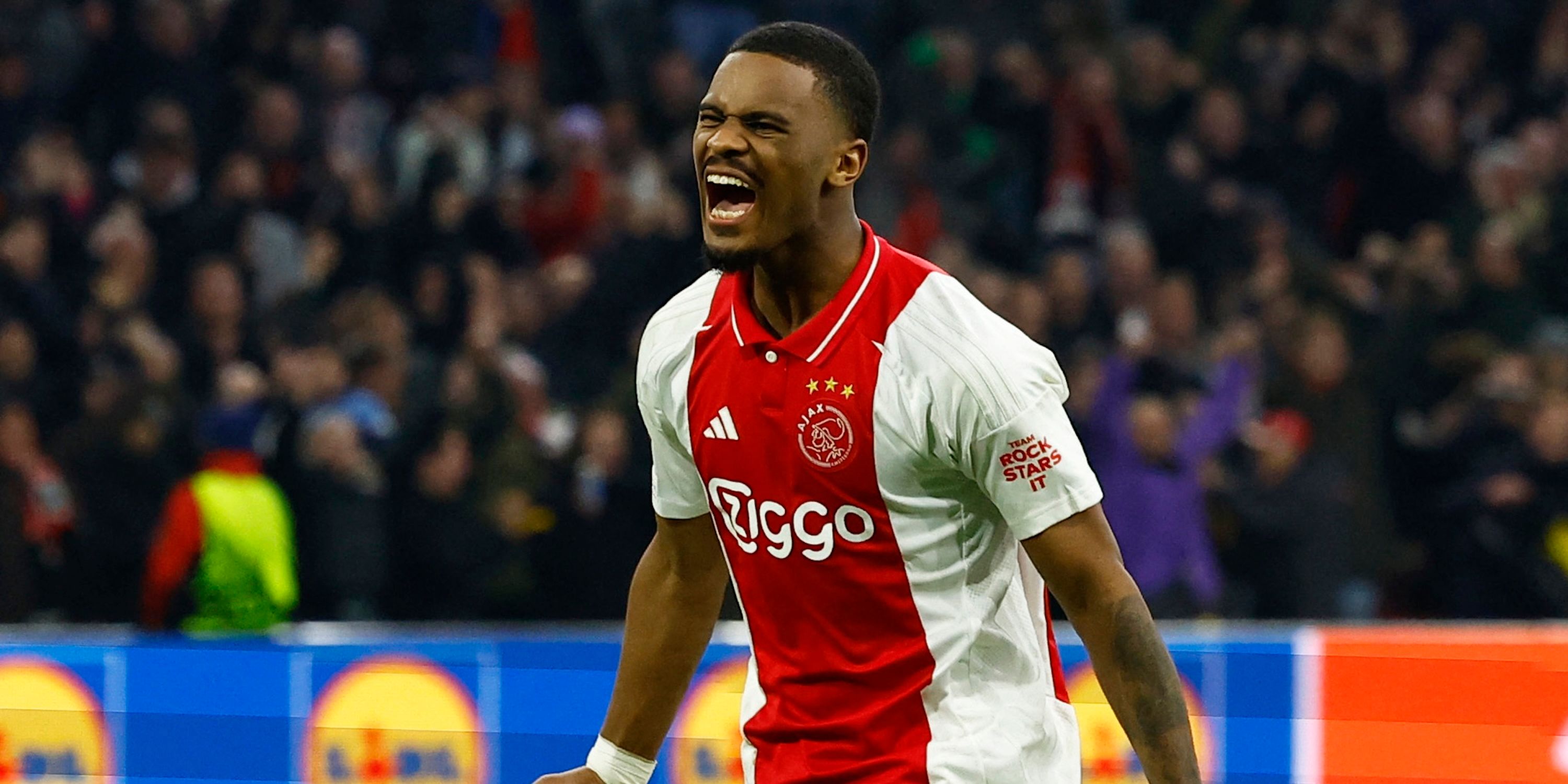 Ajax Amsterdam's Jorrel Hato celebrates after the match