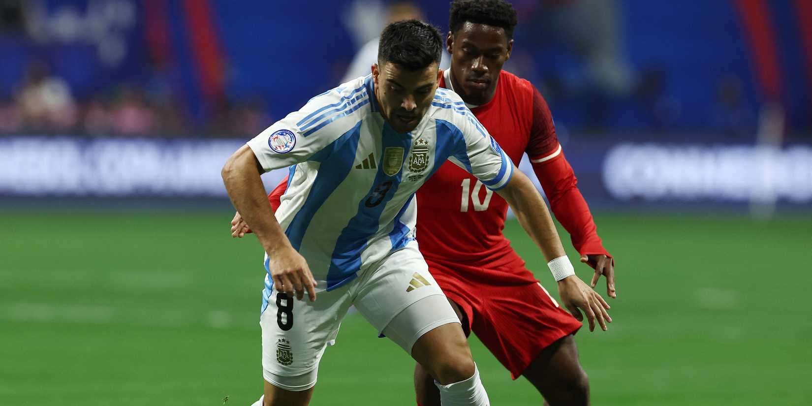 Argentina's Marcos Acuna in action with Canada's Jonathan David-1